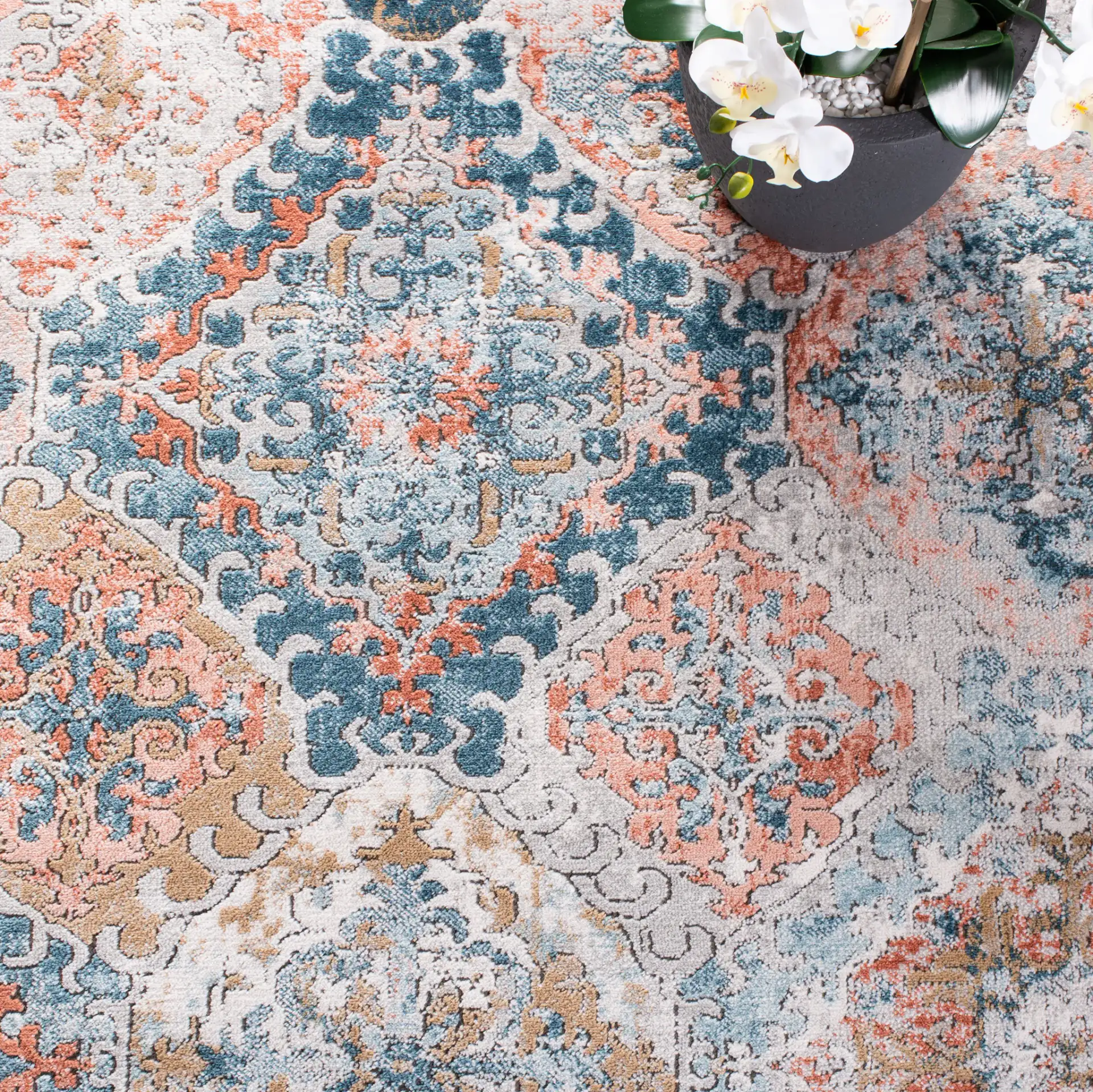 Shivan Medallion Tile Rug in Blue / Rose in a styled room