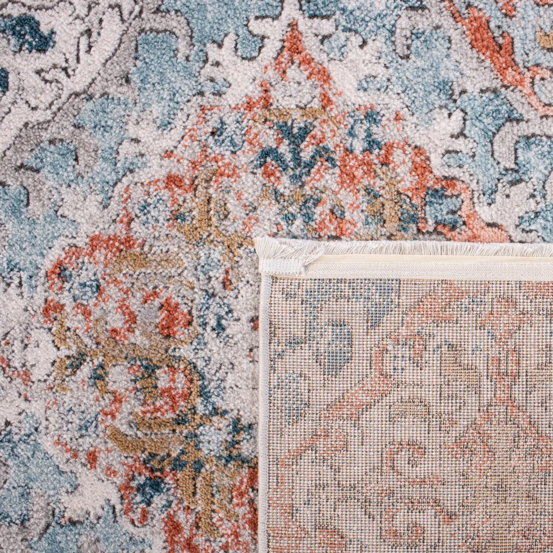 Shivan Medallion Tile Rug in Blue / Rose in a styled room