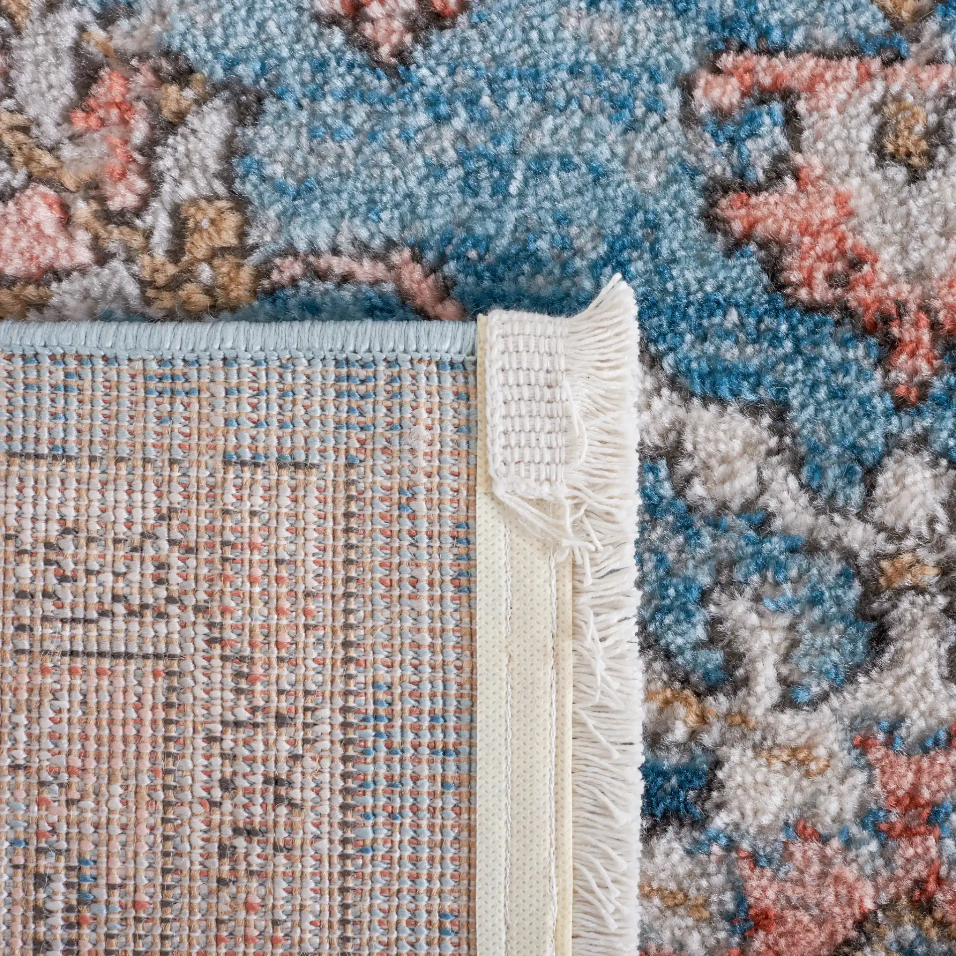 Shivan Bordered Floral Rug in Blue / Red in a styled room