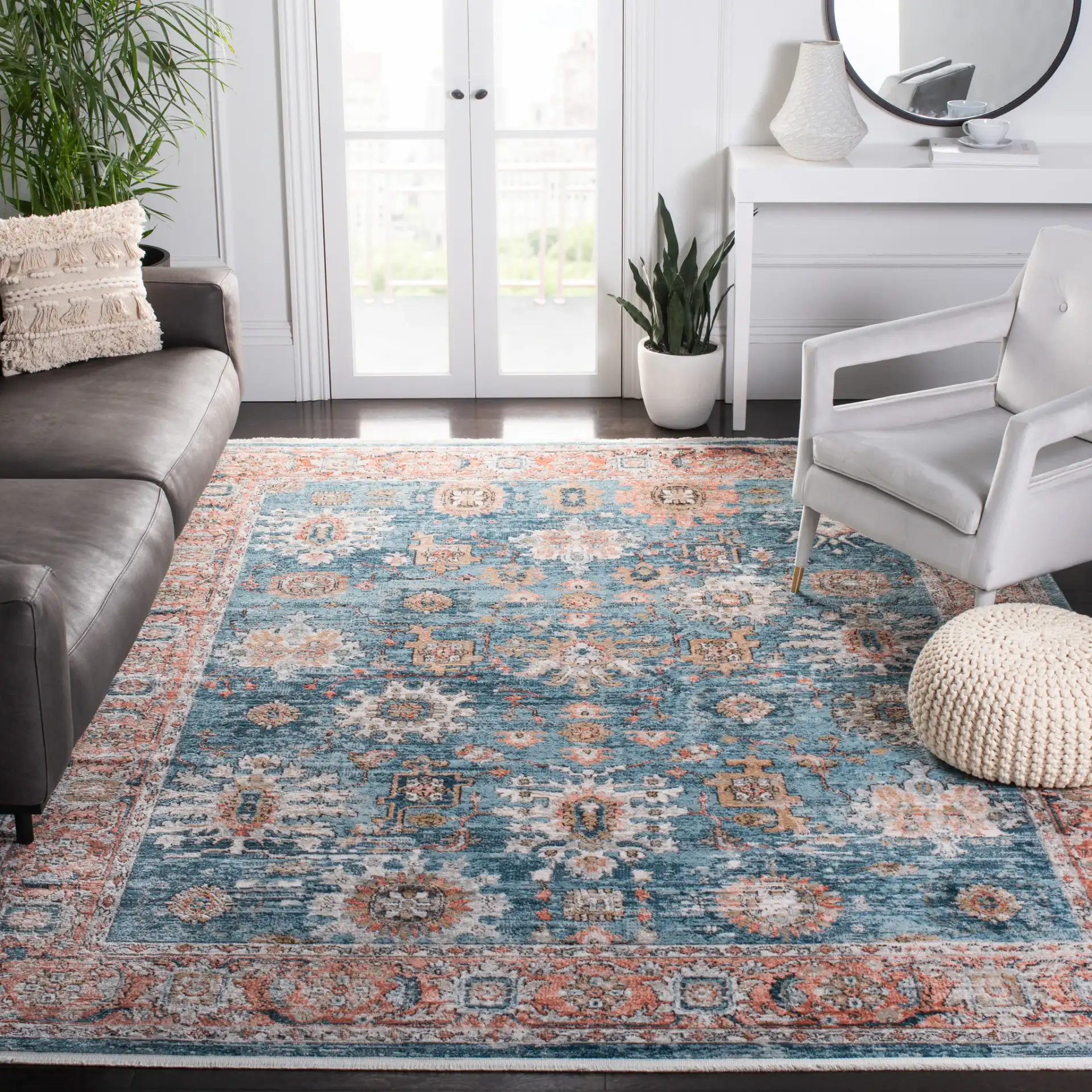 Shivan Bordered Floral Rug in Blue / Red in a styled room