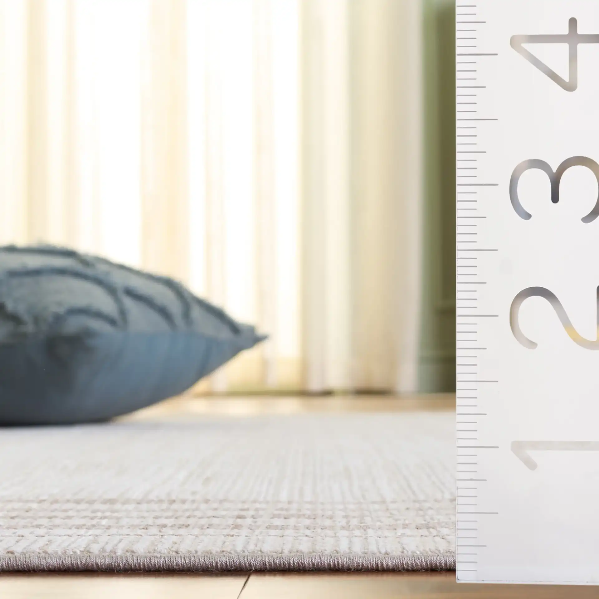 Signature Linear Border Rug in Ivory / Beige in a styled room