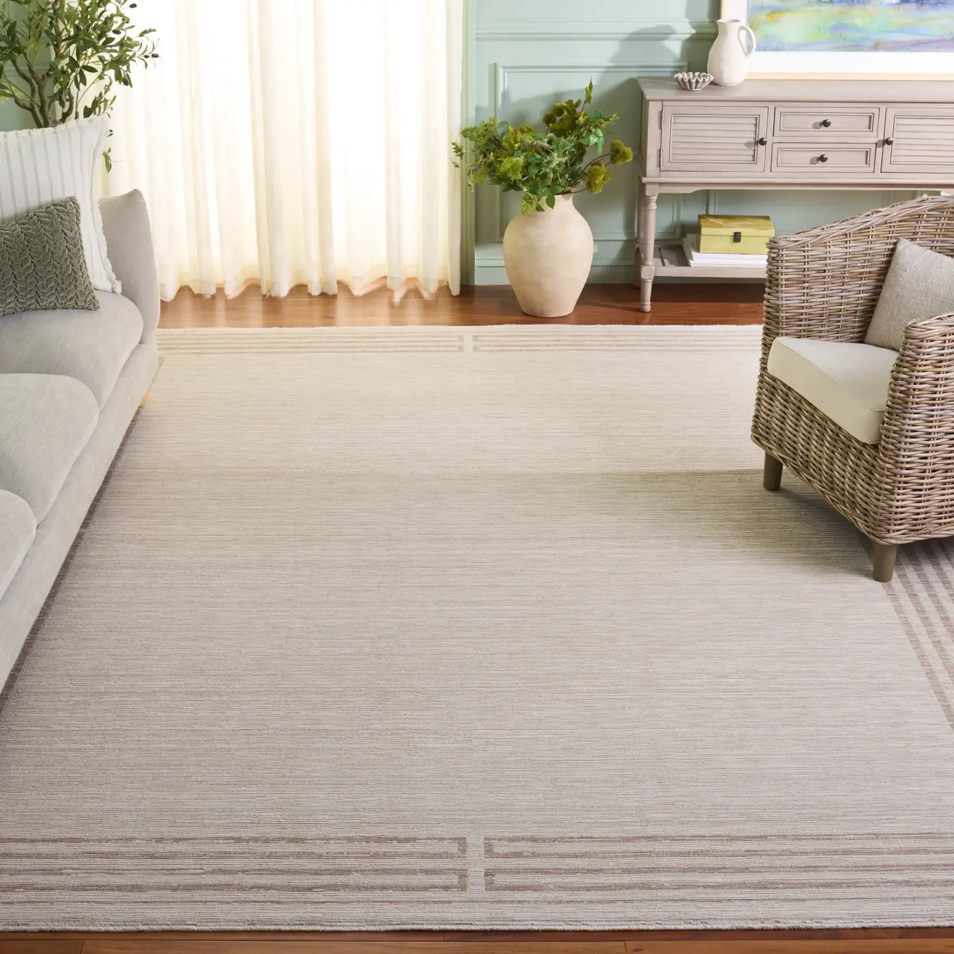 Signature Linear Border Rug in Ivory / Beige in a styled room