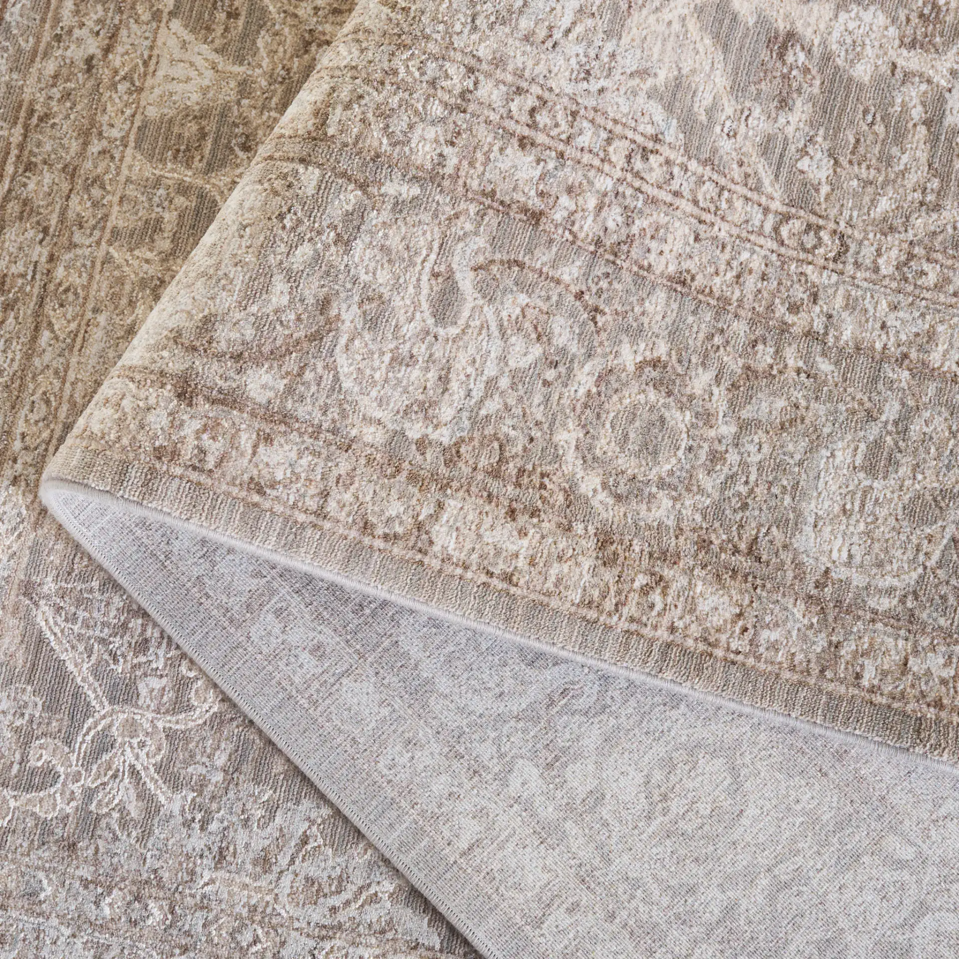 Signature Faded Bordered Floral Rug in Beige / Gray in a styled room