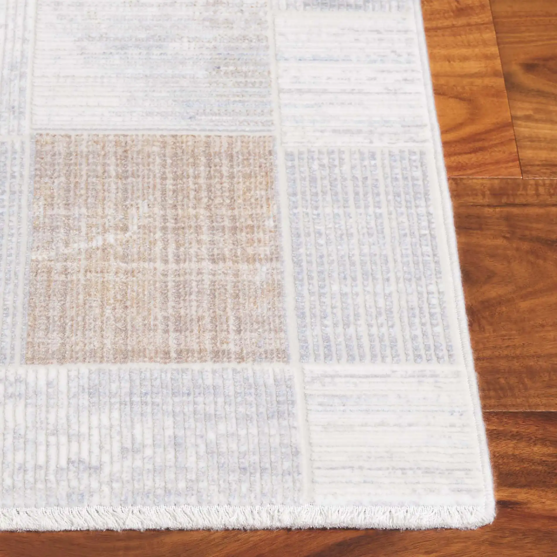 Signature Grid Patchwork Rug in Gray / Blue in a styled room