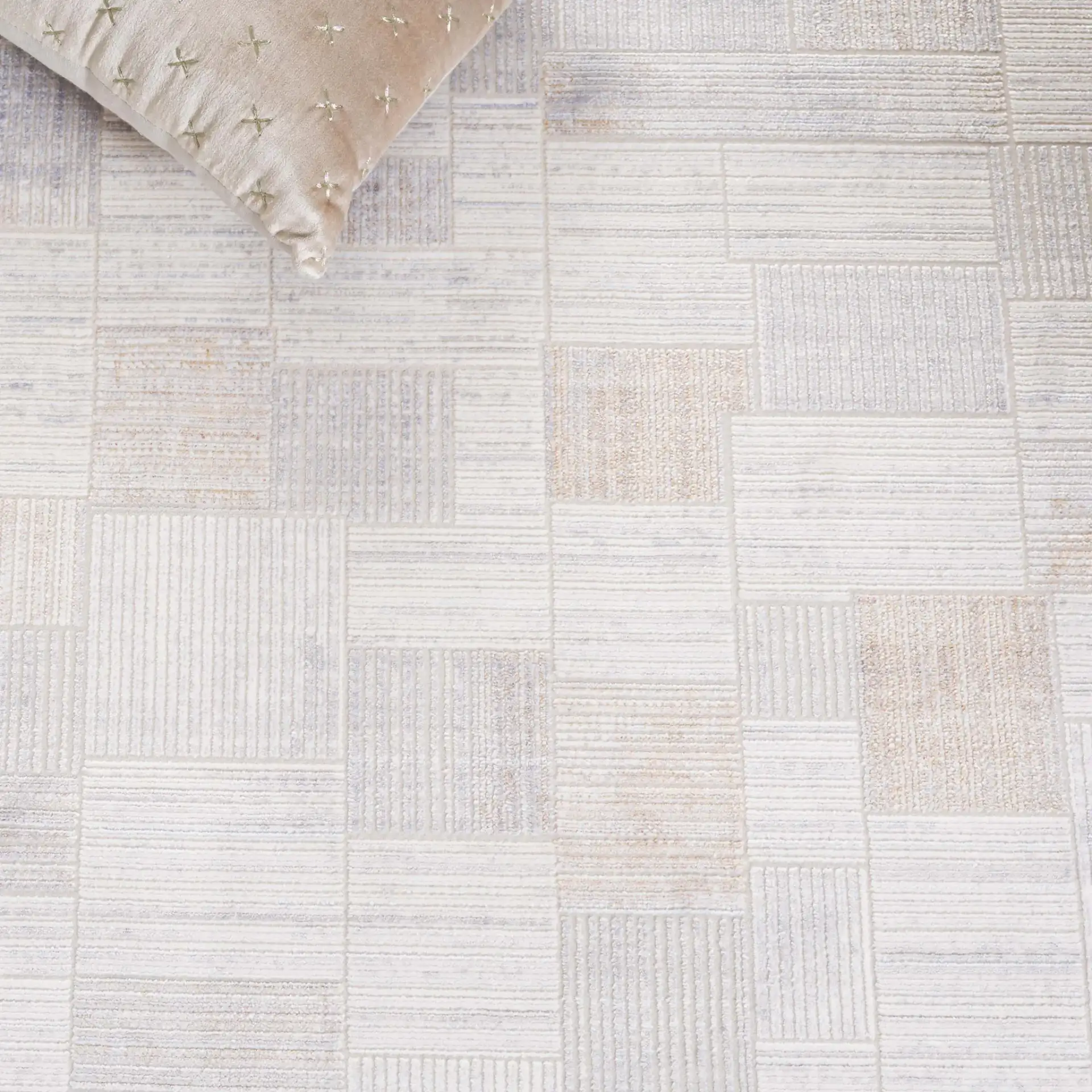 Signature Grid Patchwork Rug in Gray / Blue in a styled room