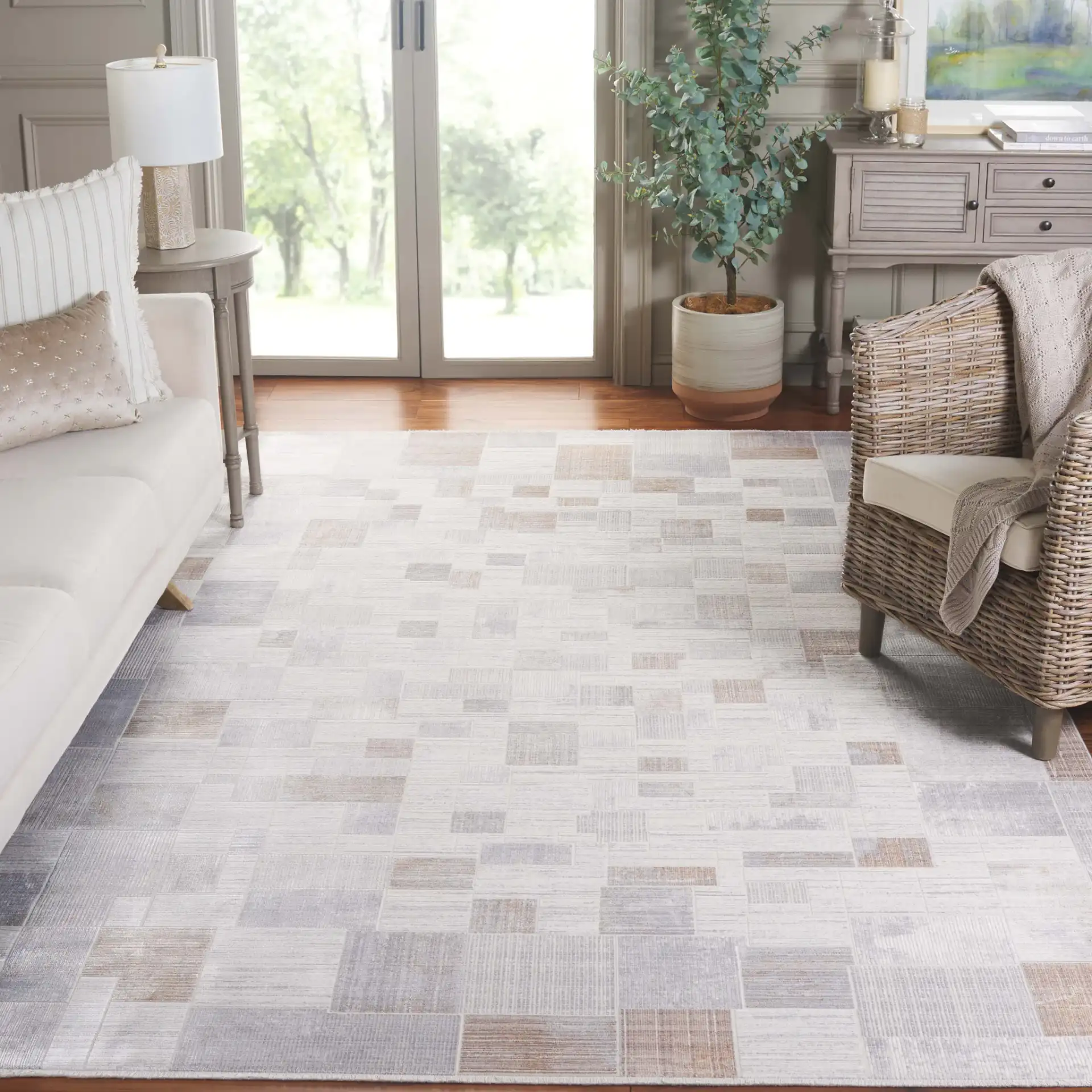 Signature Grid Patchwork Rug in Gray / Blue in a styled room
