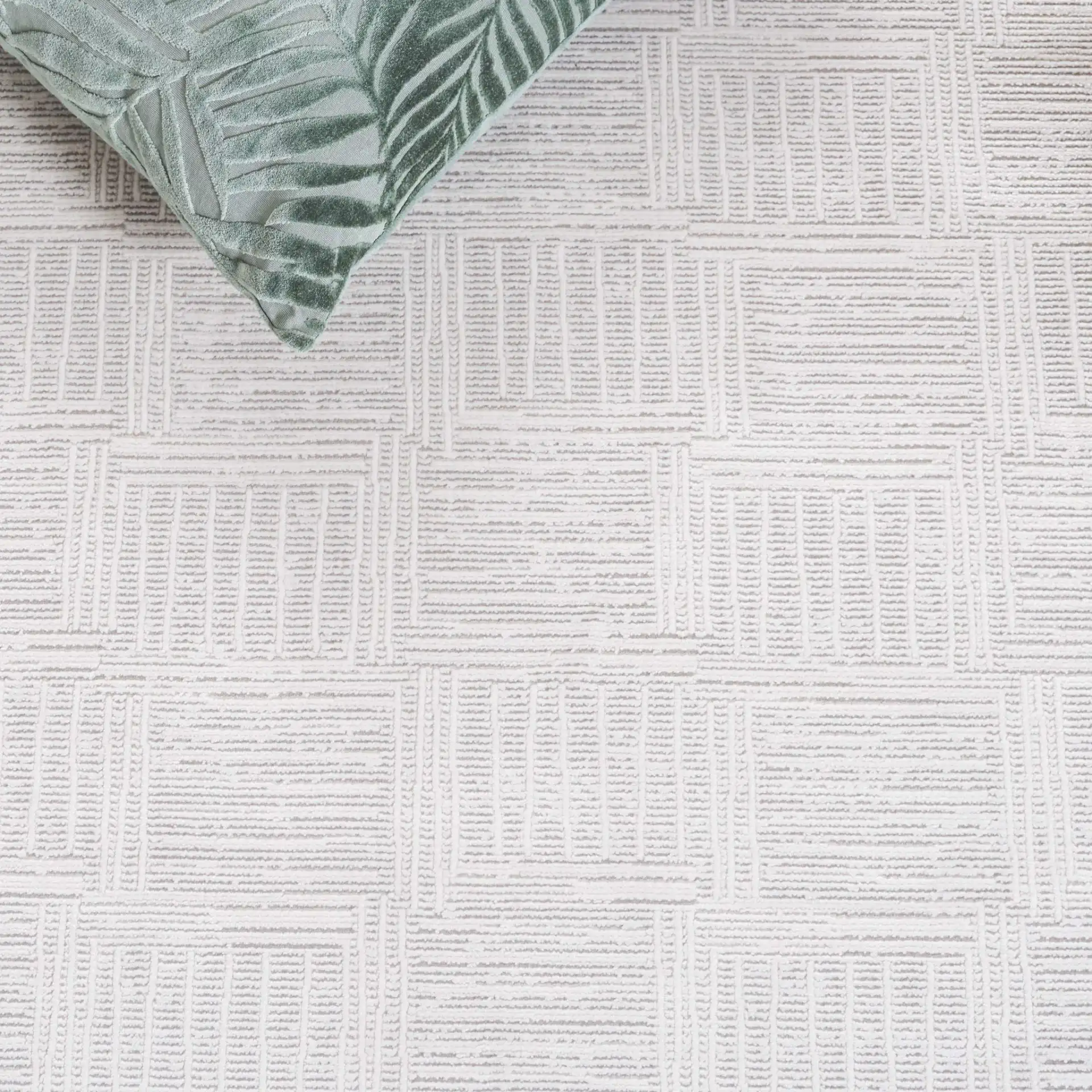 Signature Grid Basketweave Border Rug in Gray / Ivory in a styled room