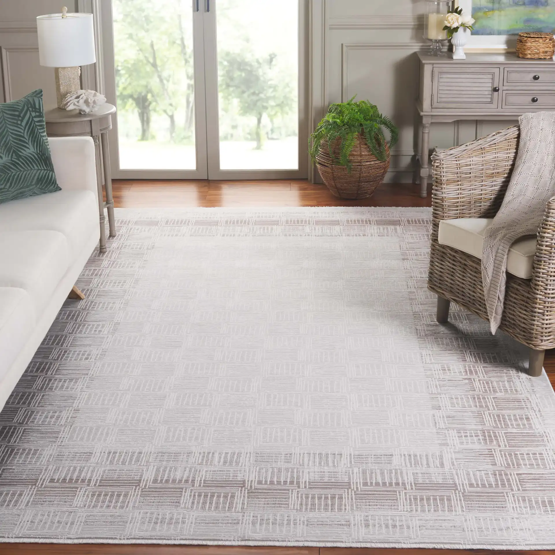 Signature Grid Basketweave Border Rug in Gray / Ivory in a styled room