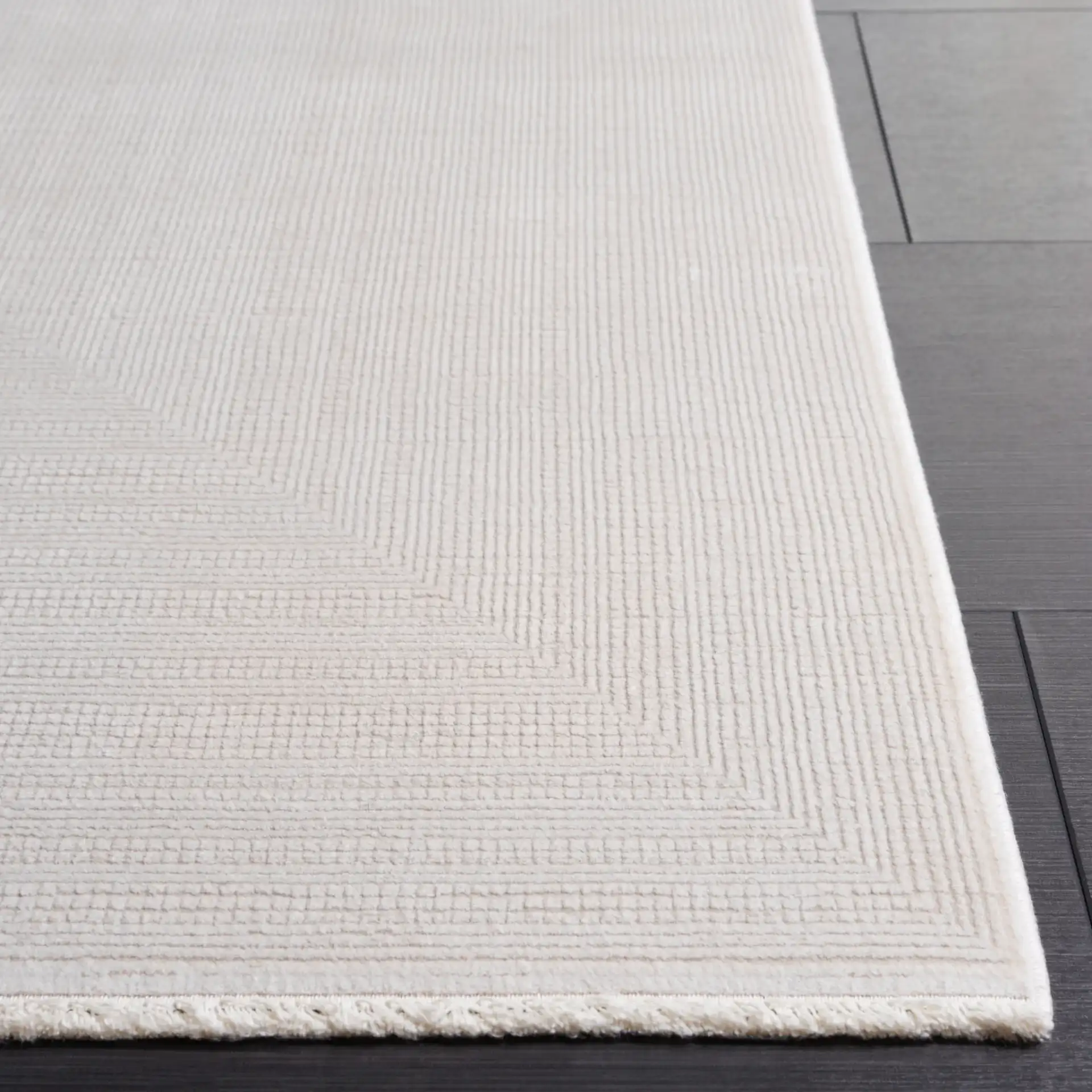Signature Silken Solid Ribbed Rug in Ivory in a styled room