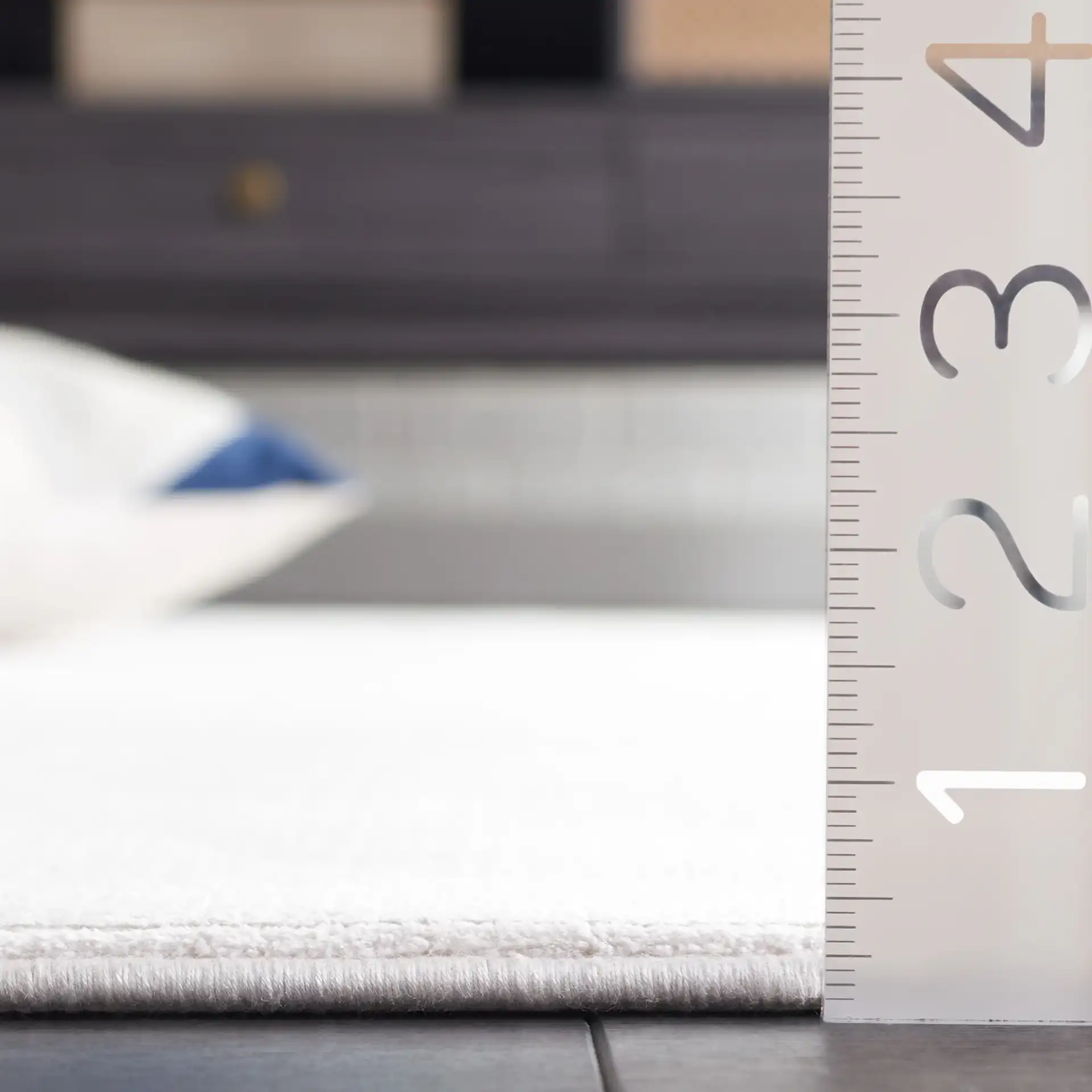 Signature Silken Solid Ribbed Rug in Ivory in a styled room