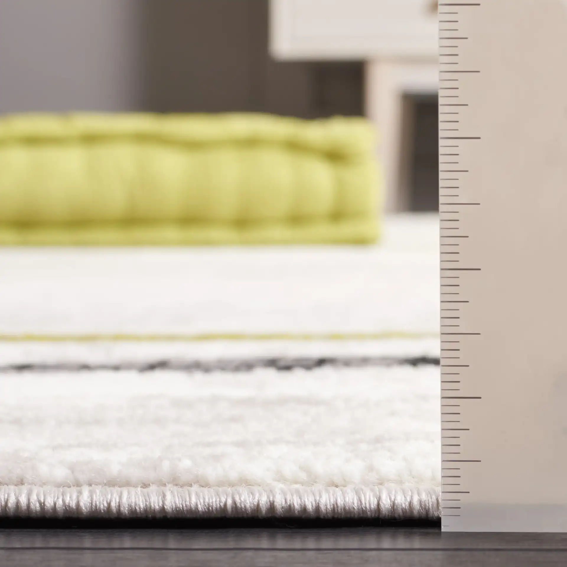 Skyler Abstract Wave Rug in Ivory Gray / Green in a styled room