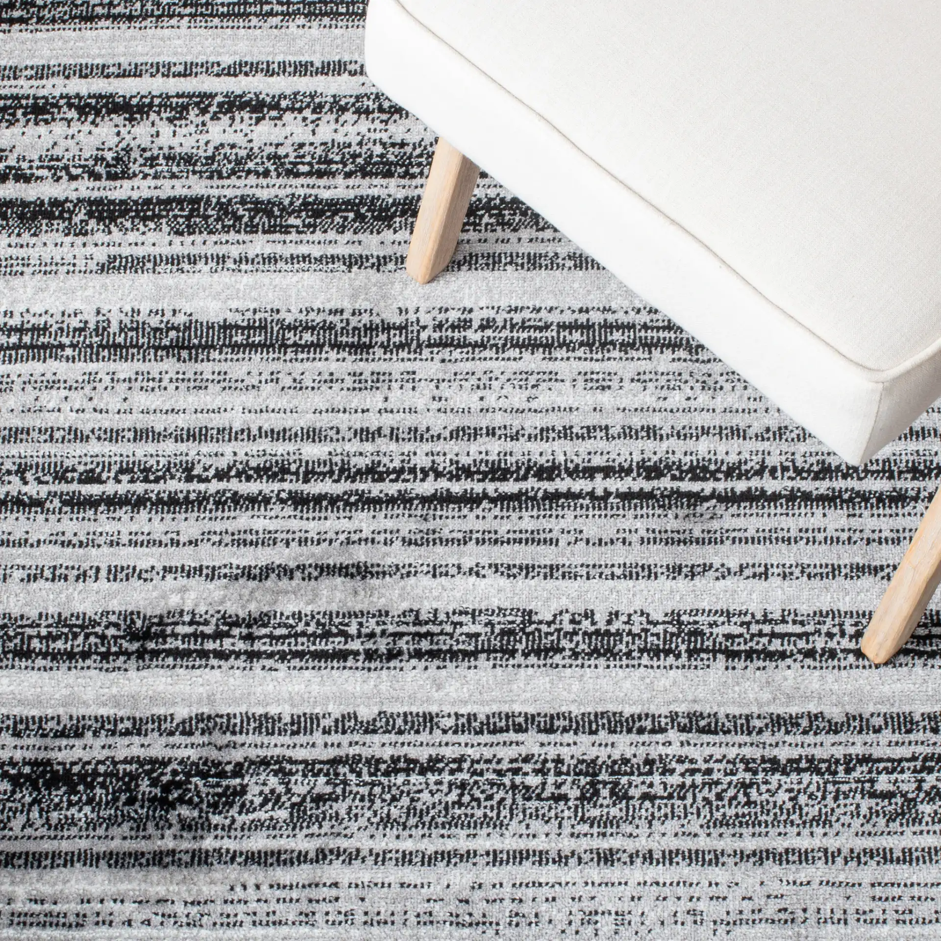 Skyler Striped Rug in Gray / Black in a styled room