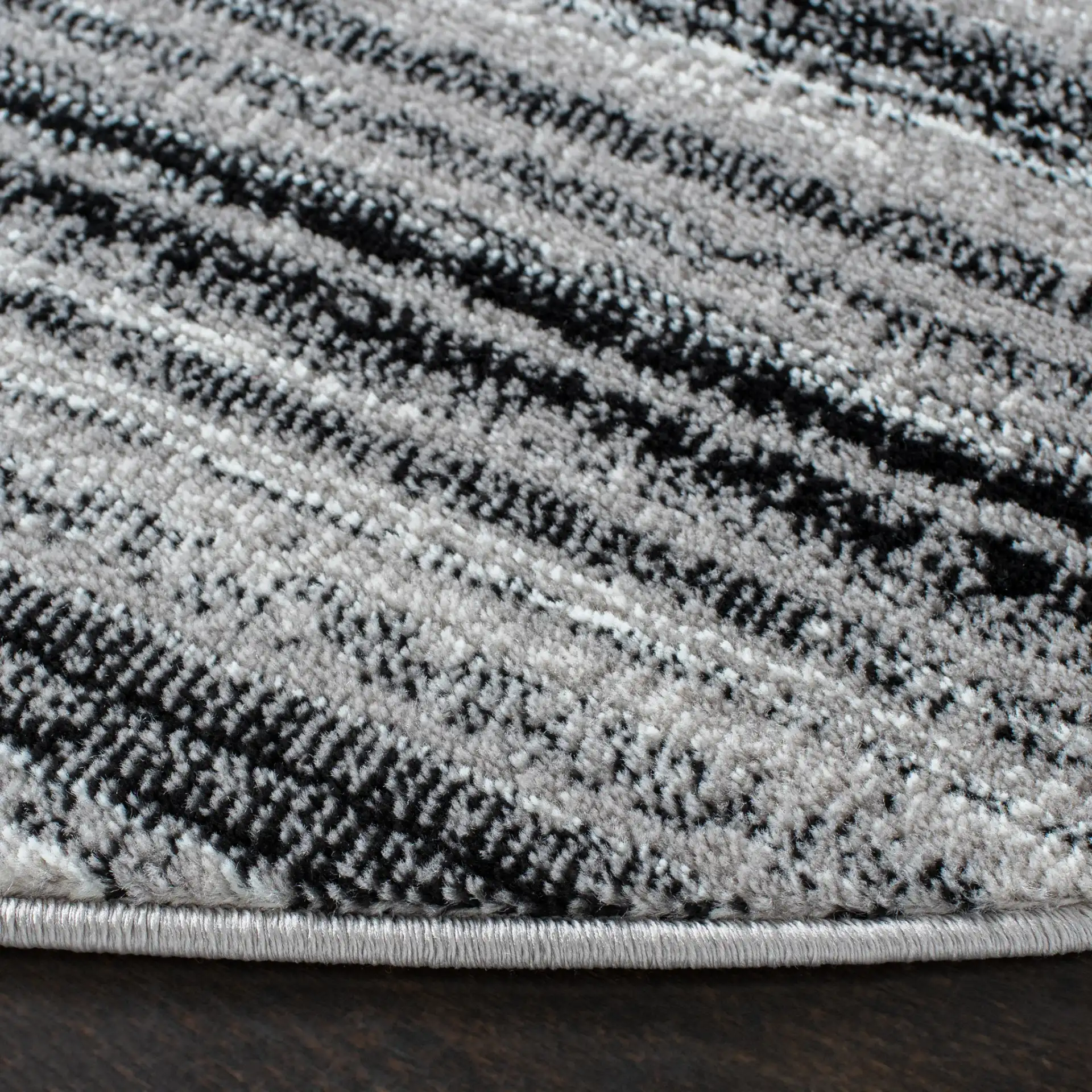 Skyler Striped Rug in Gray / Black in a styled room