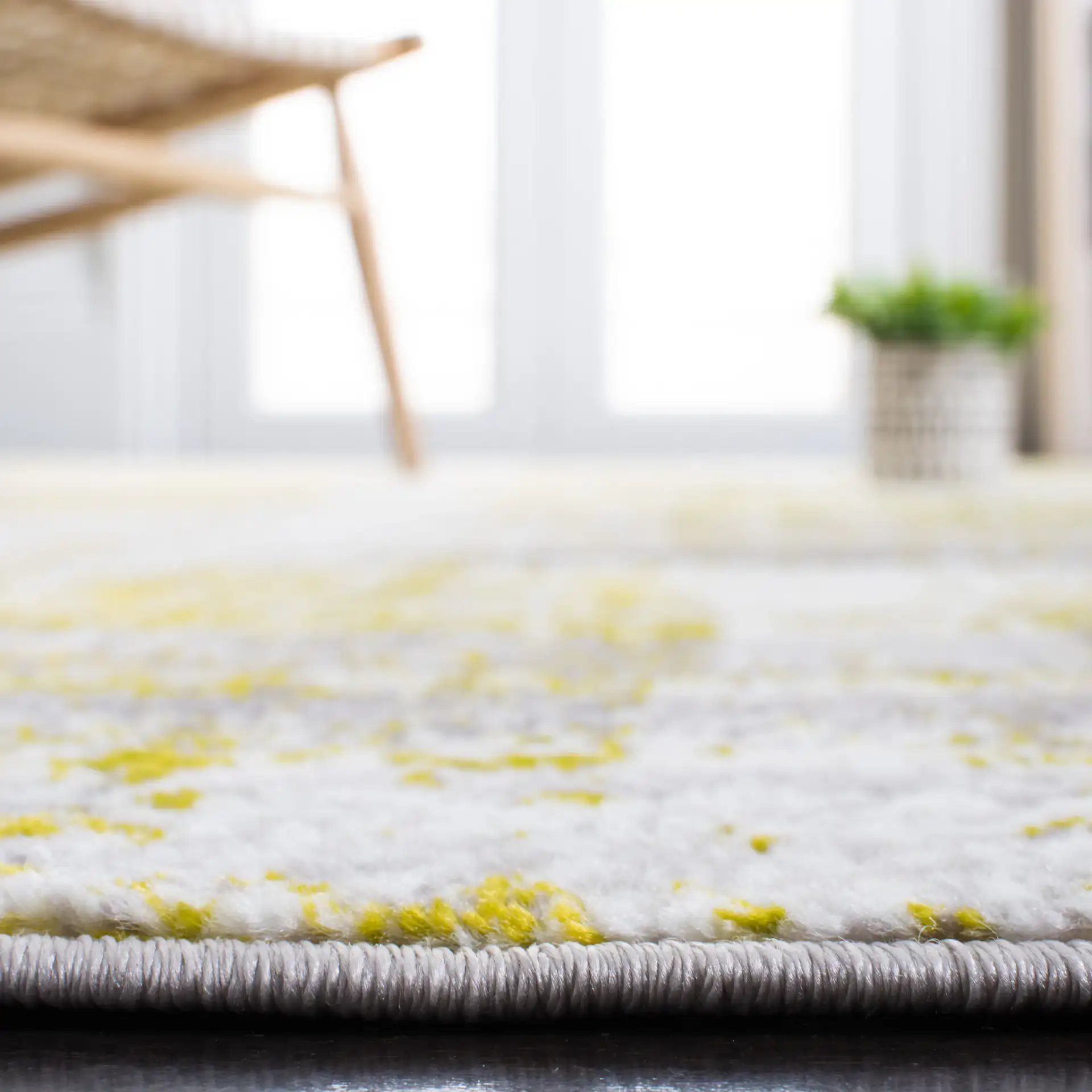 Skyler Distressed Stripe Rug in Silver / Green in a styled room