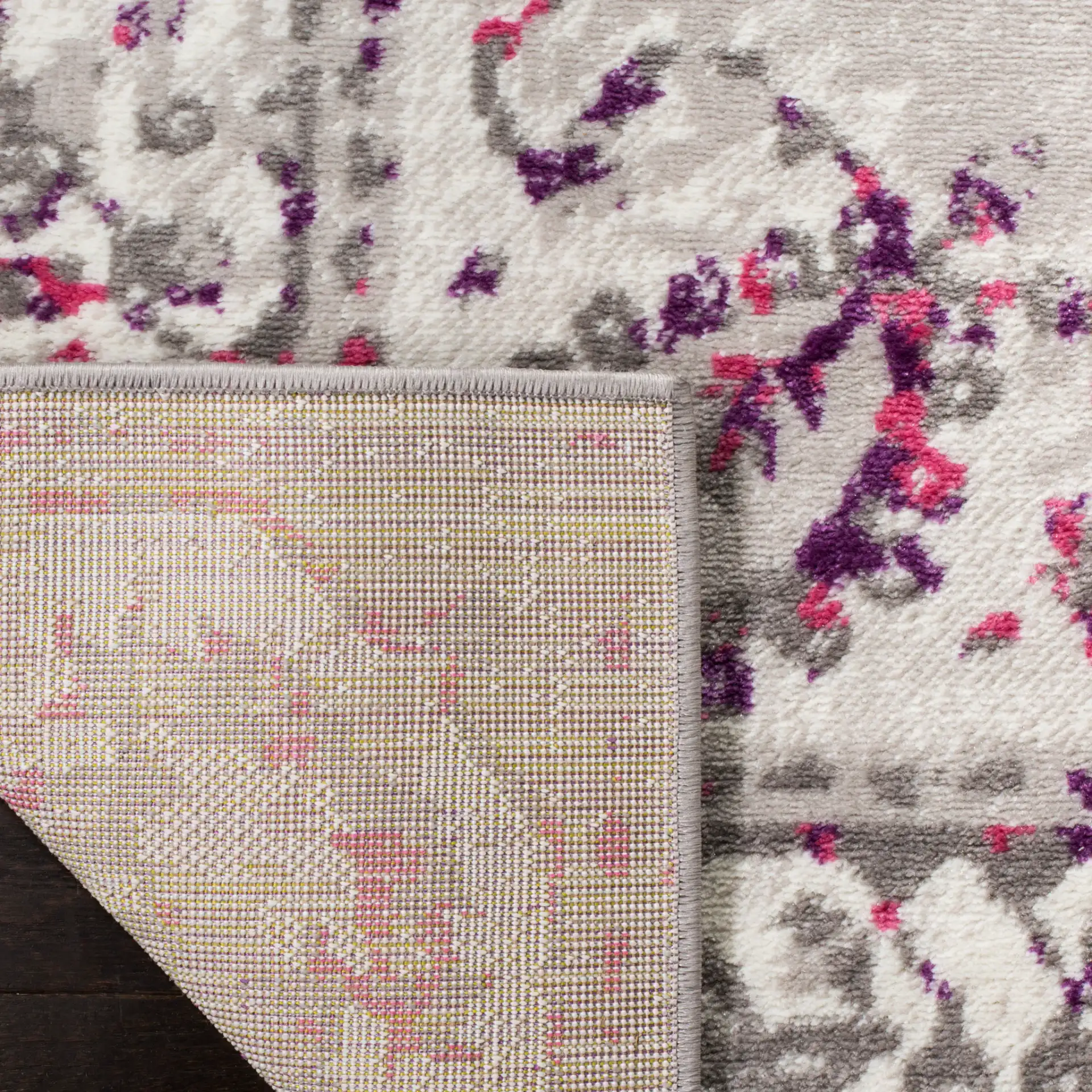 Skyler Distressed Medallion Rug in Gray / Pink in a styled room