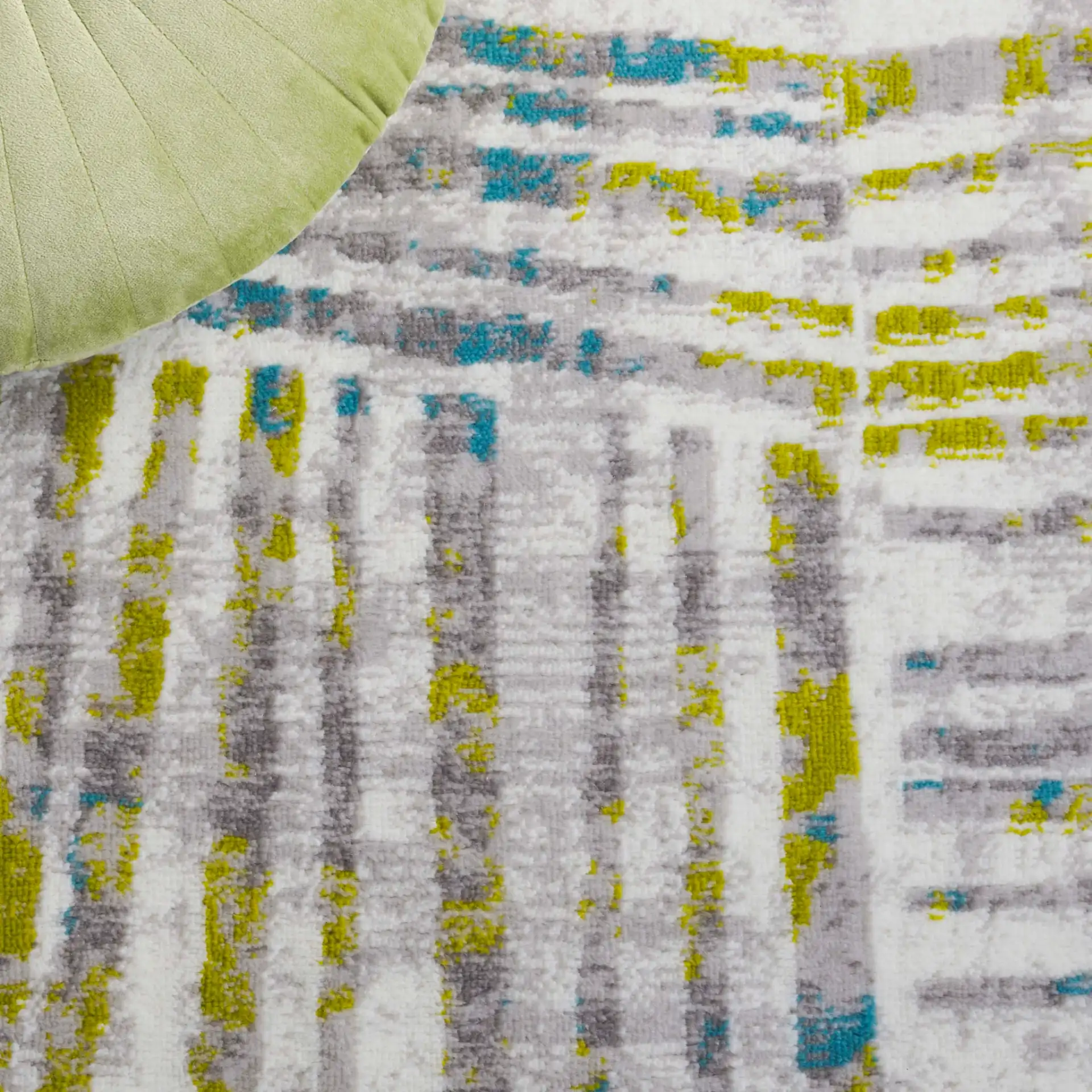 Skyler Abstract Stripe Rug in Gray / Green in a styled room