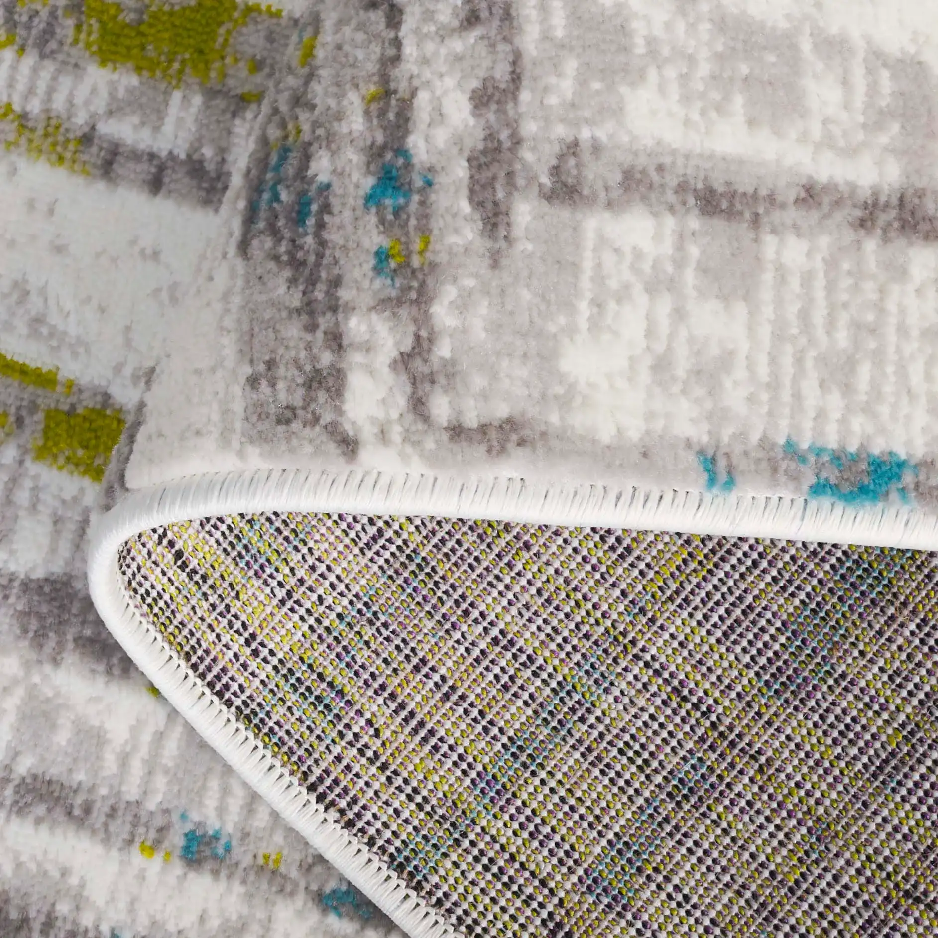 Skyler Abstract Stripe Rug in Gray / Green in a styled room