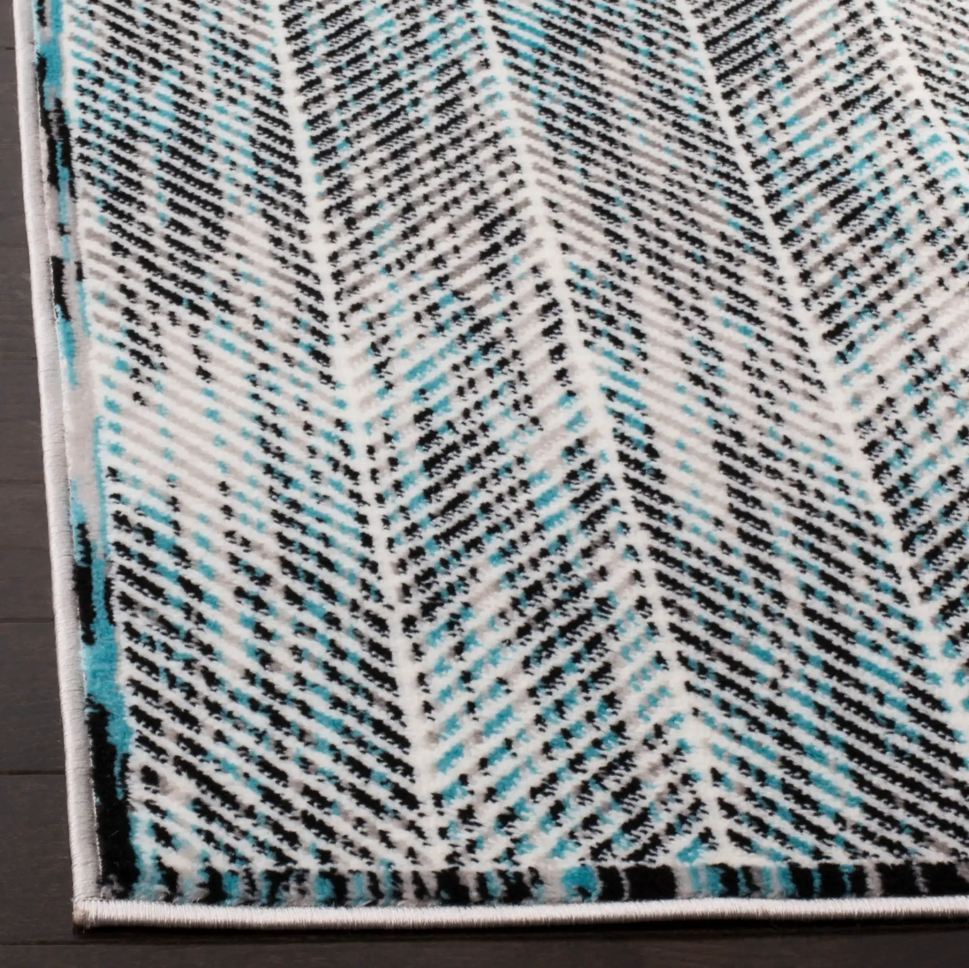 Skyler Herringbone Rug in Gray / Blue in a styled room