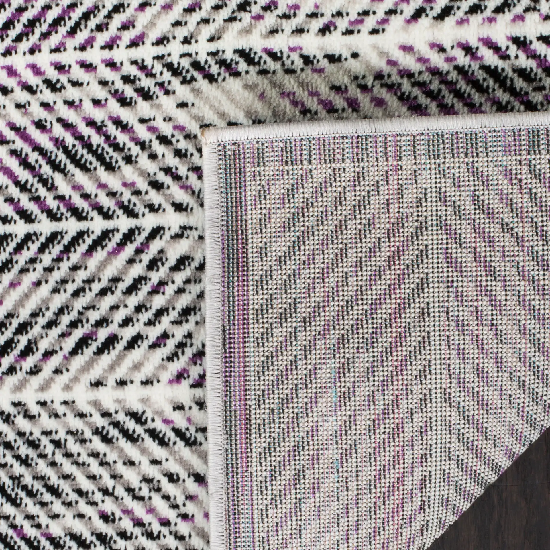 Skyler Herringbone Rug in Gray / Purple in a styled room