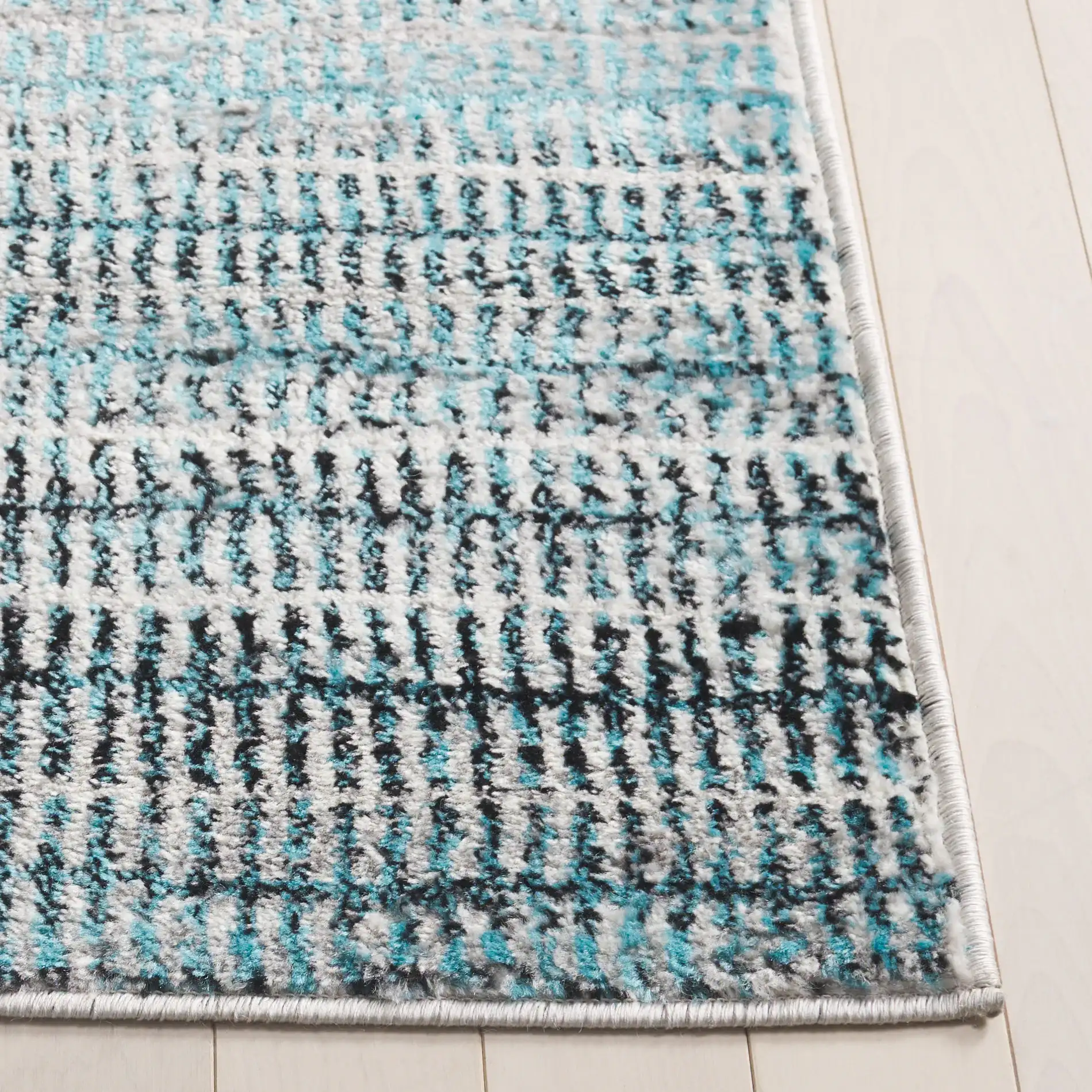 Skyler Dashed Stripe Rug in Blue / Gray in a styled room