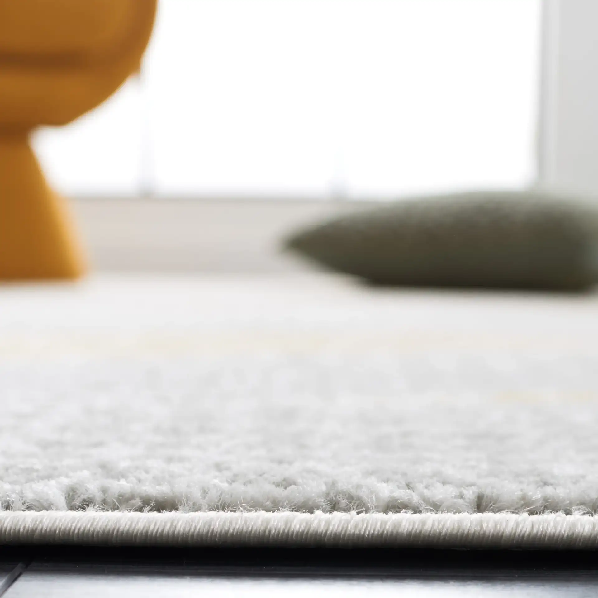 Skyler Dotted Wave Rug in Gray Beige / Gold in a styled room
