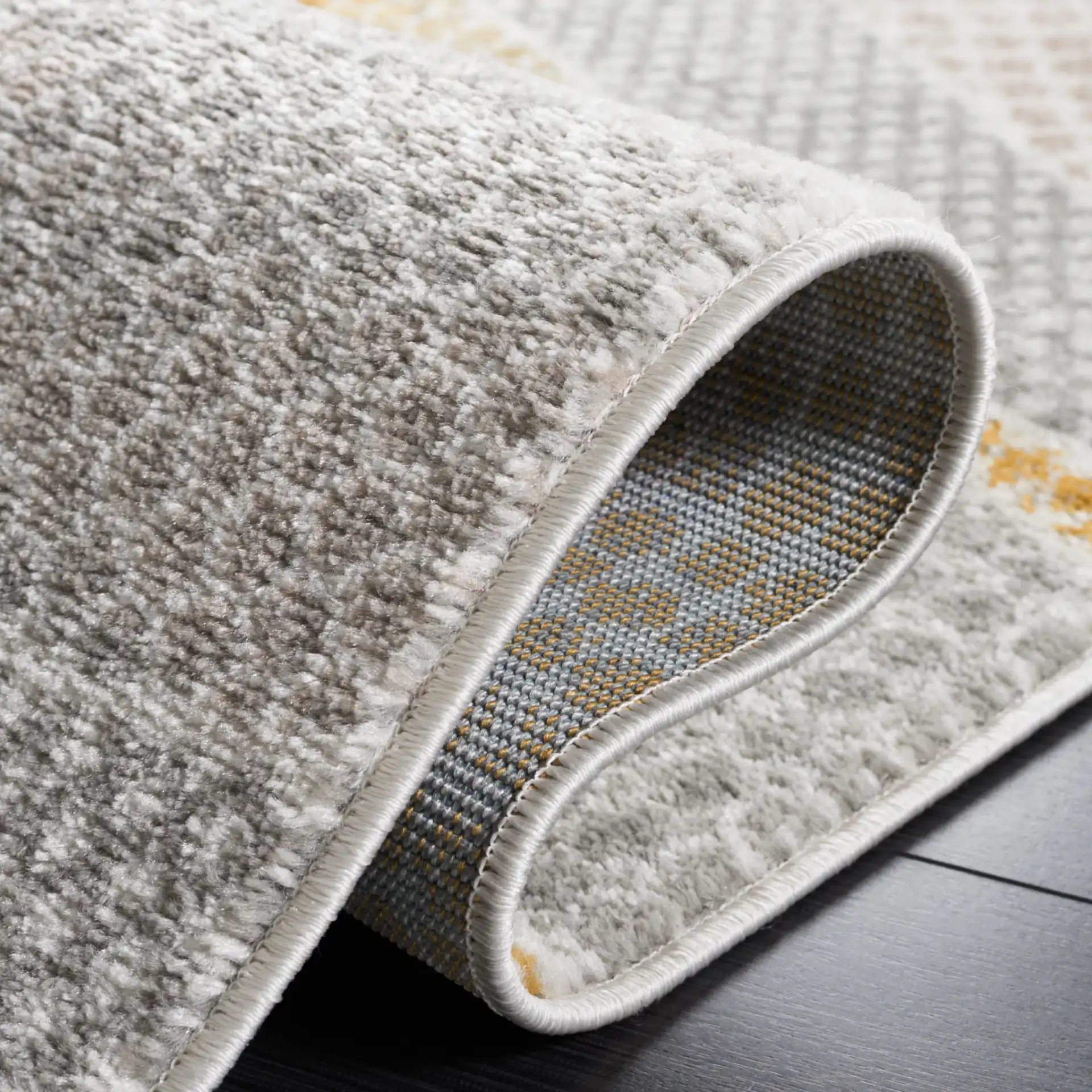 Skyler Dotted Wave Rug in Gray Beige / Gold in a styled room