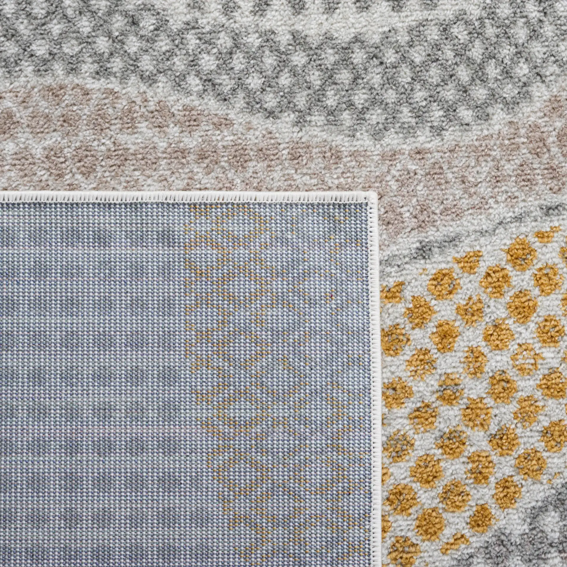 Skyler Dotted Wave Rug in Gray Beige / Gold in a styled room