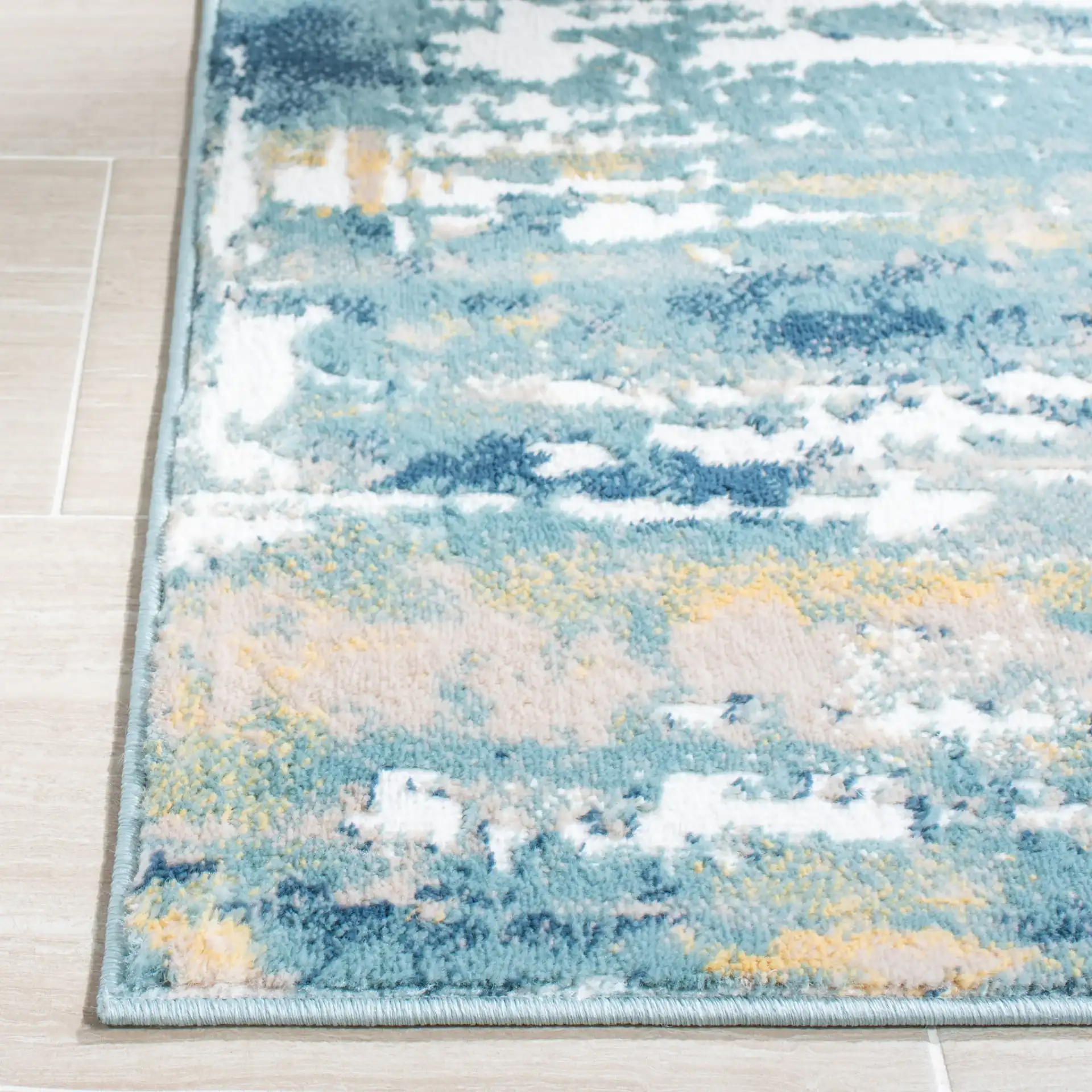 Skyler Abstract Painterly Rug in Teal / Gold in a styled room