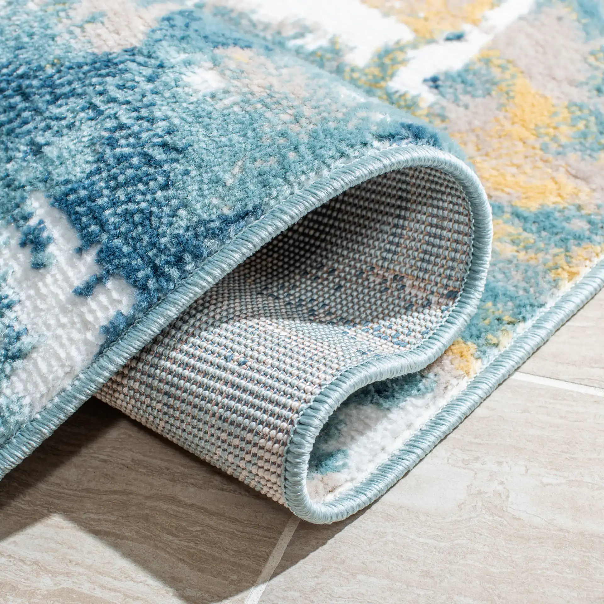 Skyler Abstract Painterly Rug in Teal / Gold in a styled room