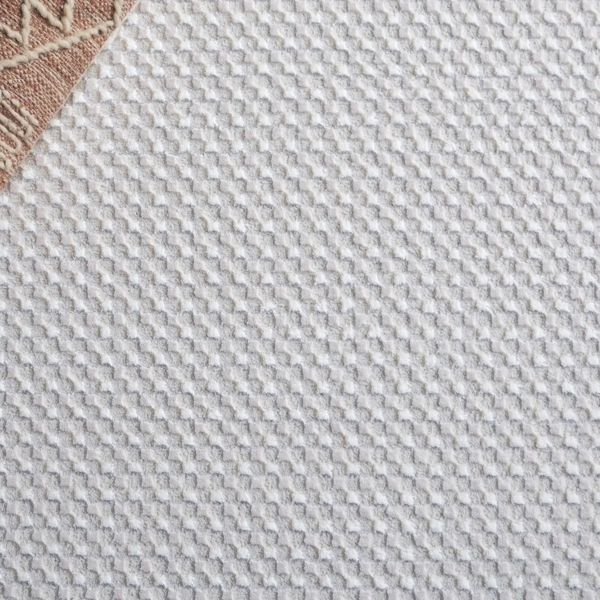 Slate Textured Grid Rug in Taupe / Ivory in a styled room