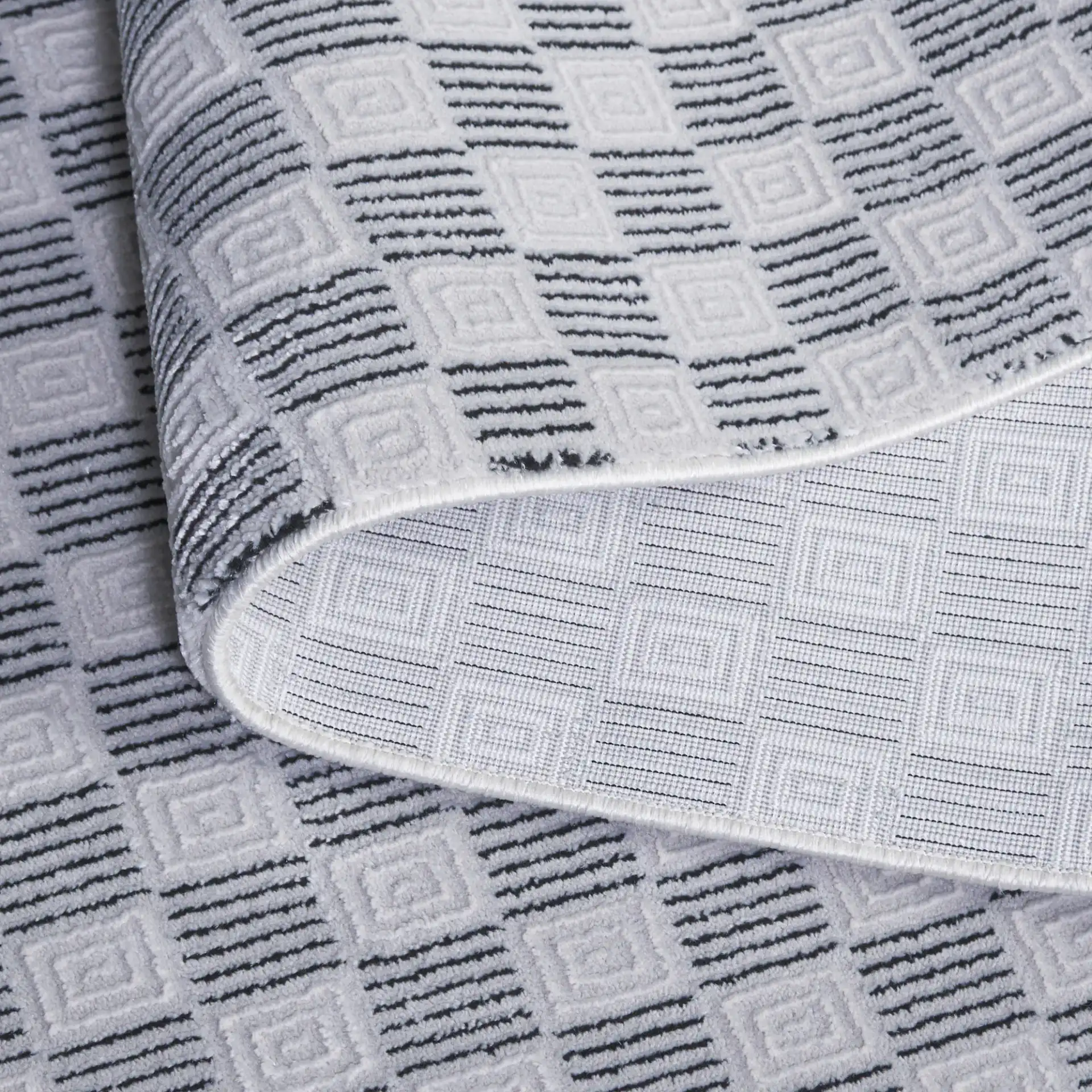 Slate Checkerboard Square Rug in Gray / Ivory Black in a styled room