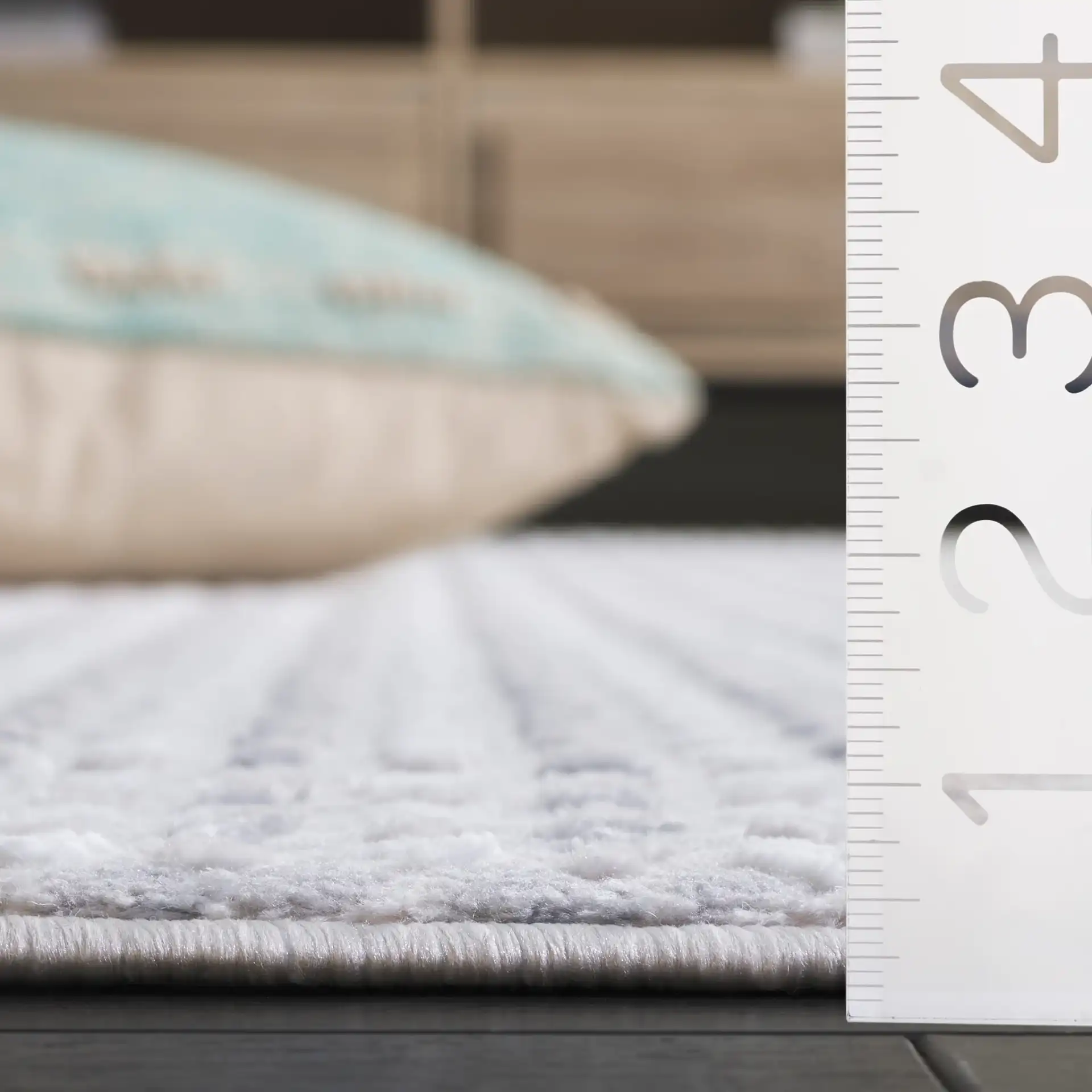 Slate Grid Rug in Gray / Ivory in a styled room