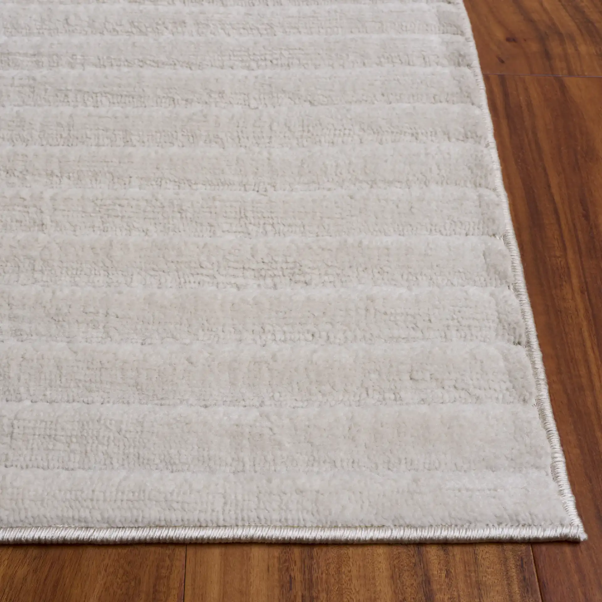 Selena Ribbed Rug in Ivory in a styled room