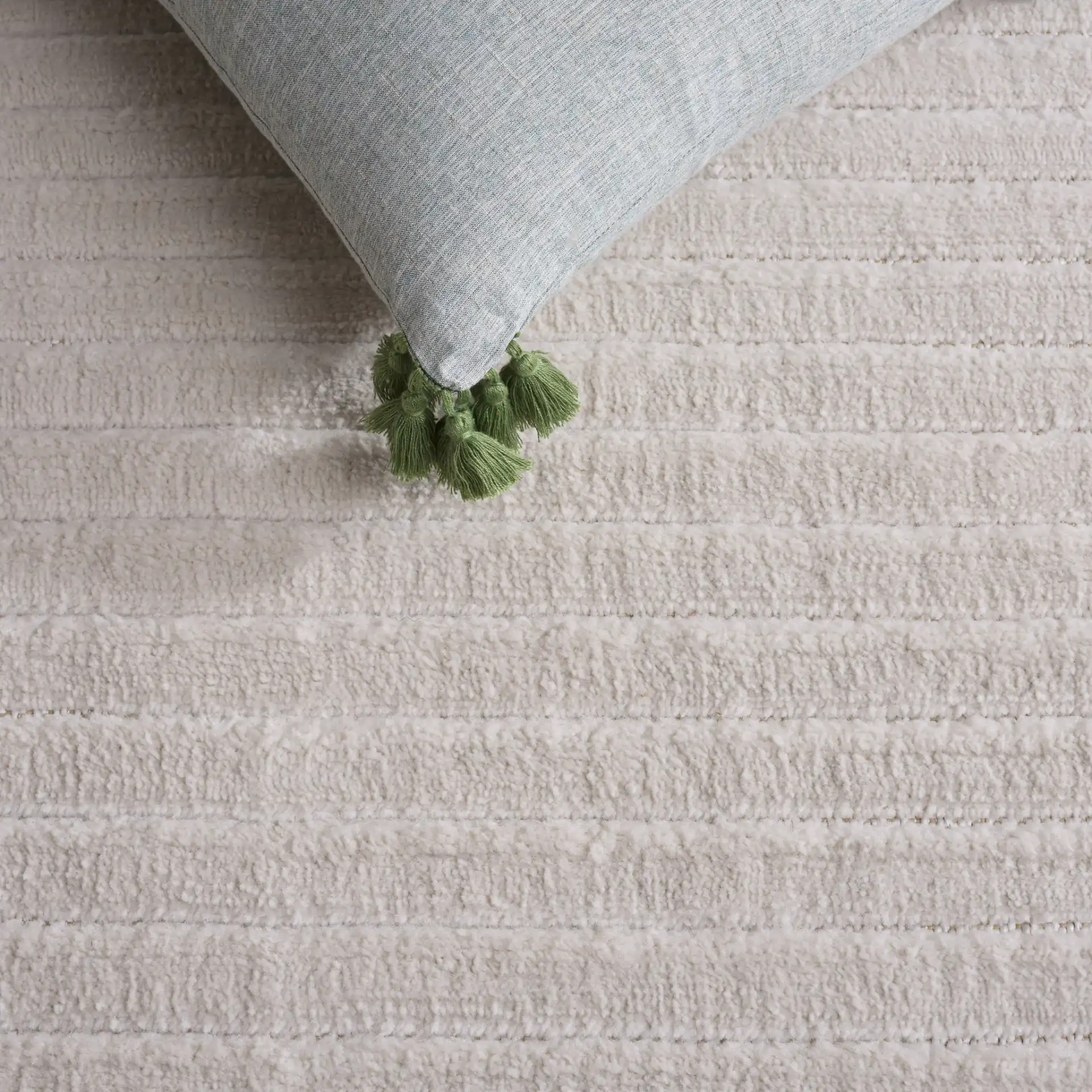 Selena Ribbed Rug in Ivory in a styled room