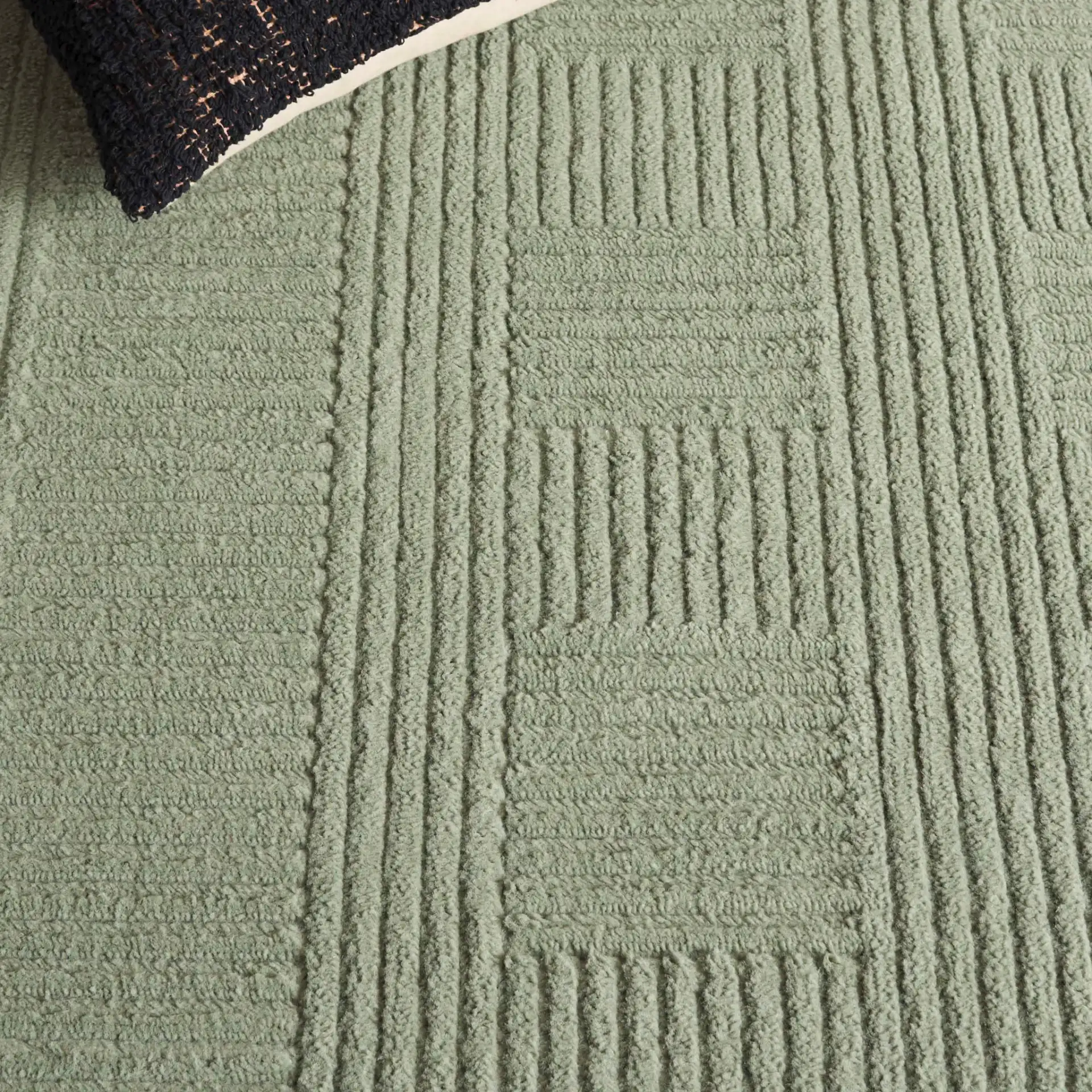 Selena Carved Geometric Rug in Green in a styled room