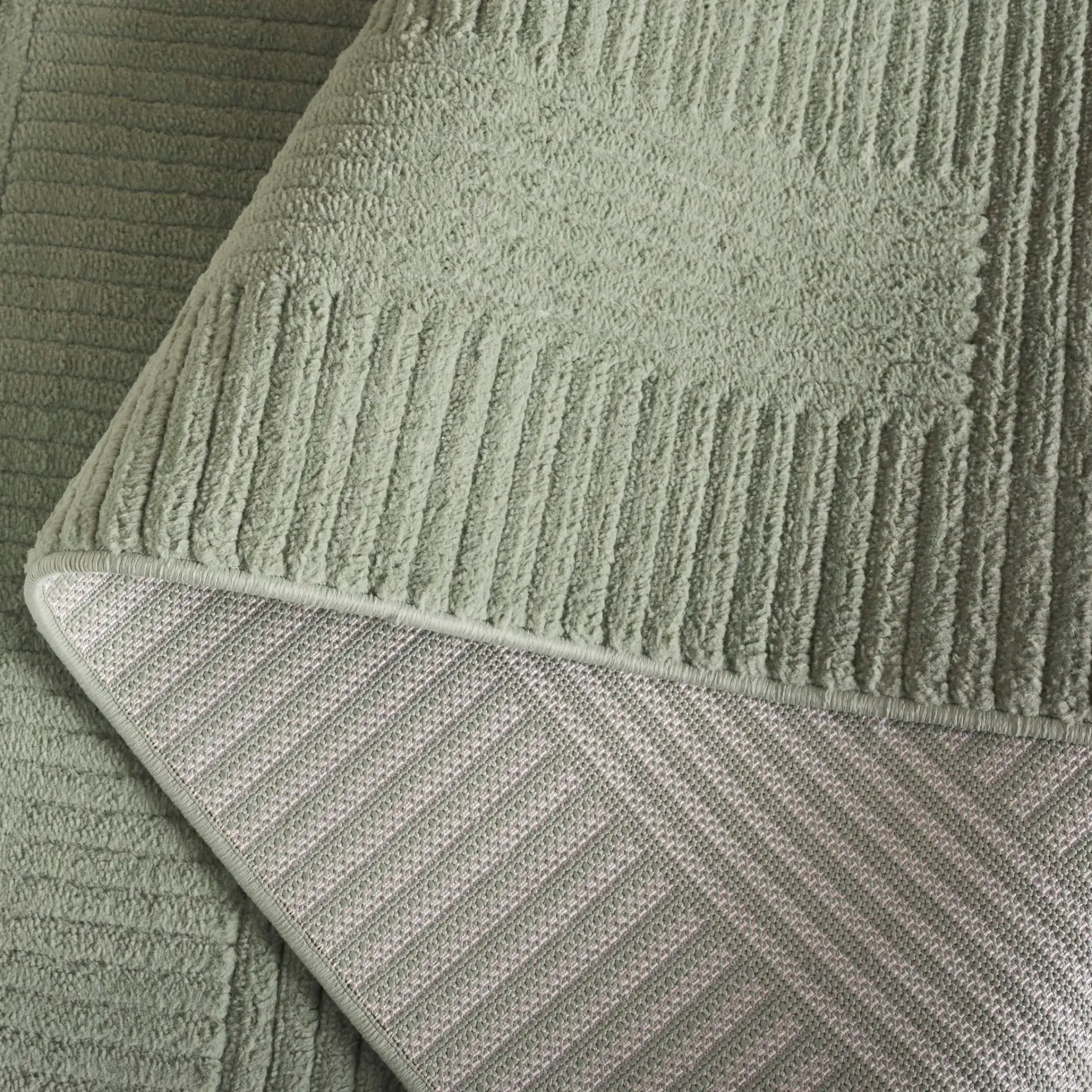 Selena Carved Geometric Rug in Green in a styled room
