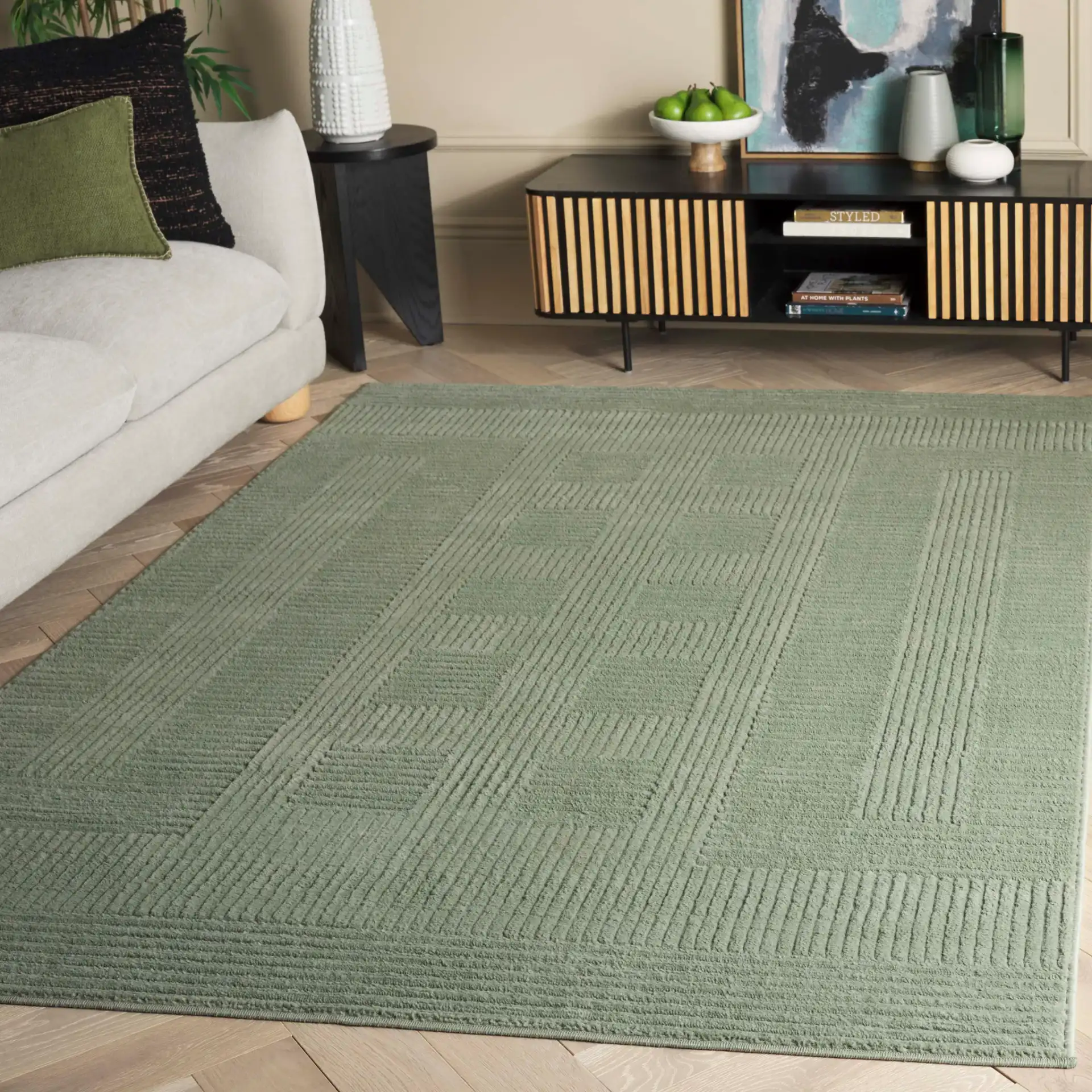 Selena Carved Geometric Rug in Green in a styled room