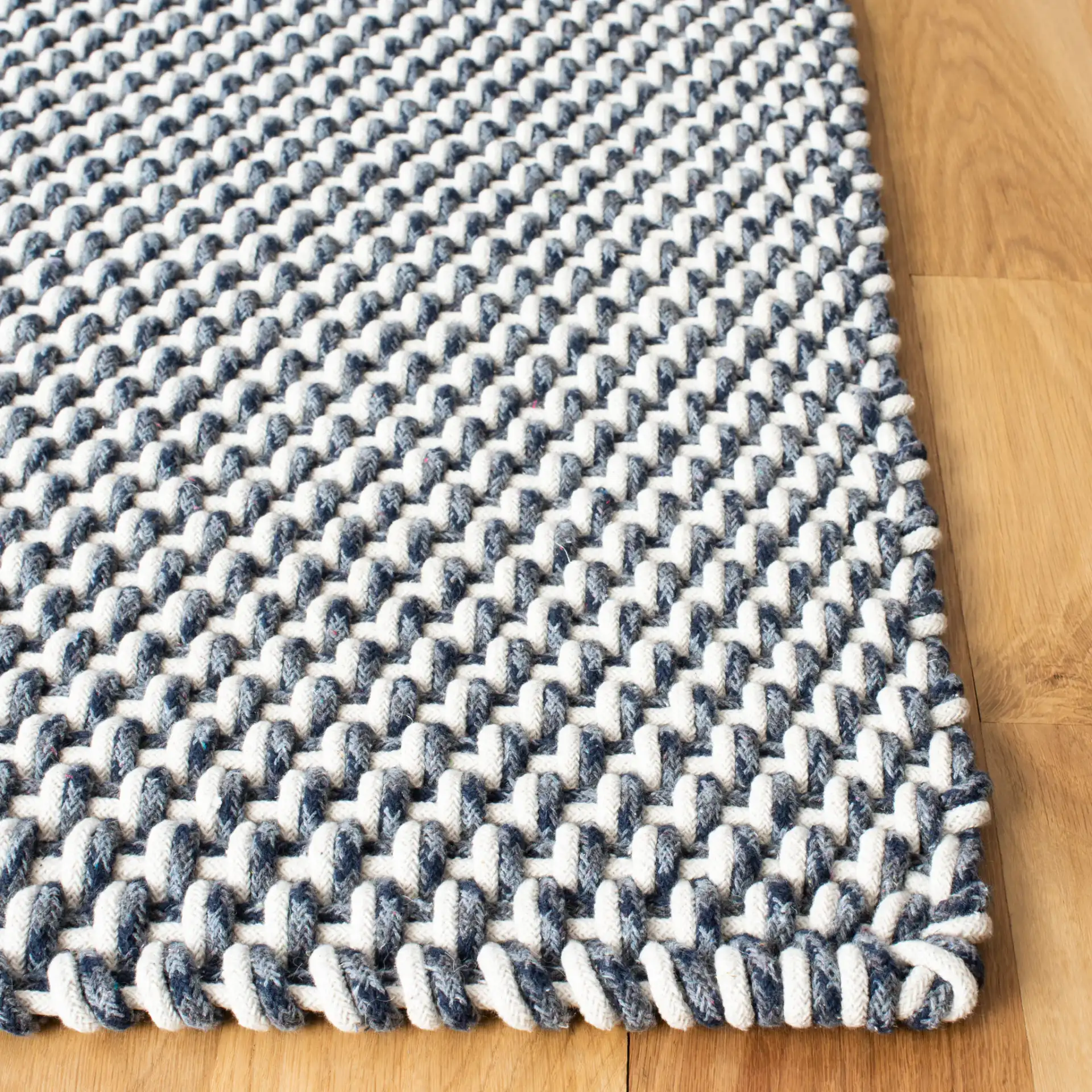 Salem Basketweave Hand-Woven Cotton Rug in Dark Blue in a styled room