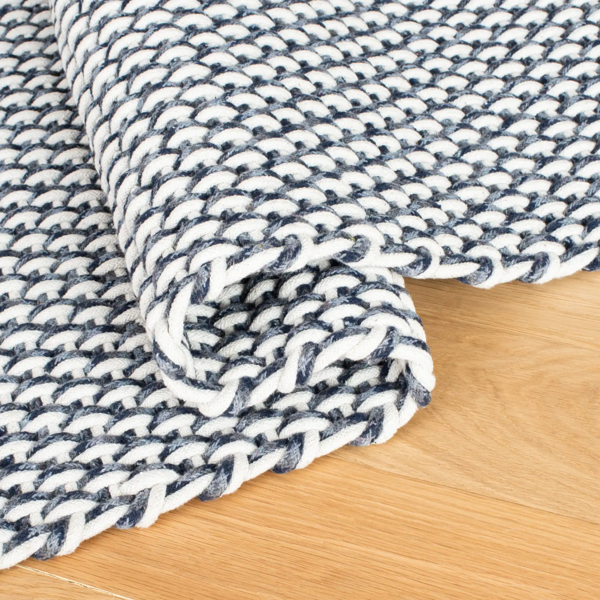 Salem Basketweave Hand-Woven Cotton Rug in Dark Blue in a styled room