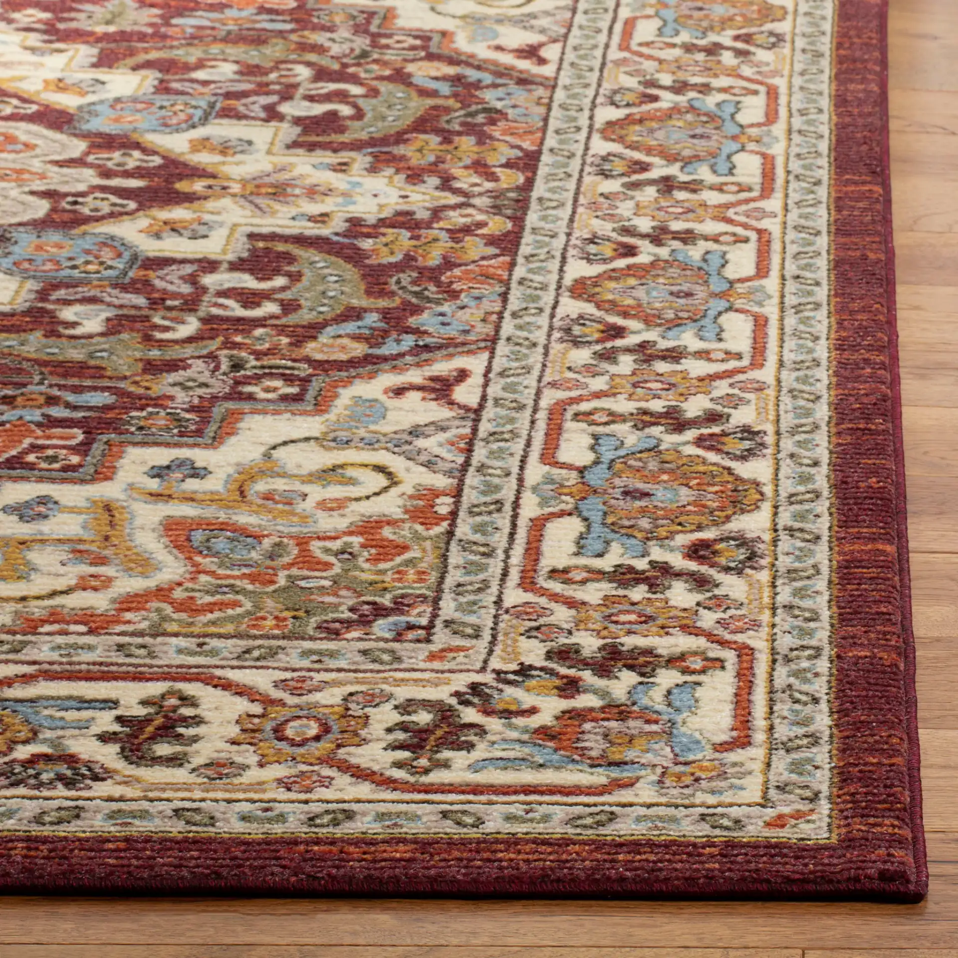 Summit Medallion Rug in Red / Cream in a styled room