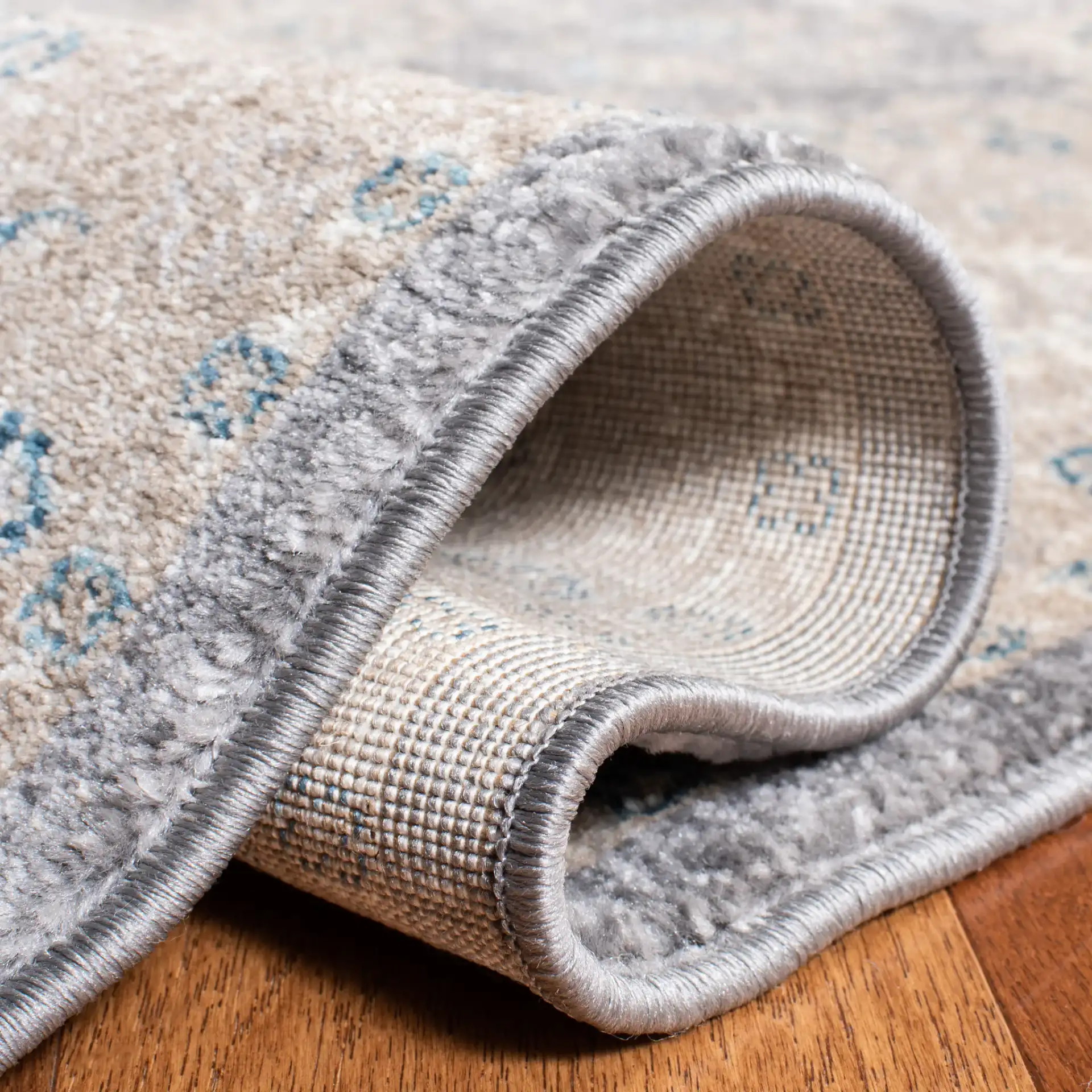 Sofia Allover Floral Bordered Rug in Light Gray / Beige in a styled room