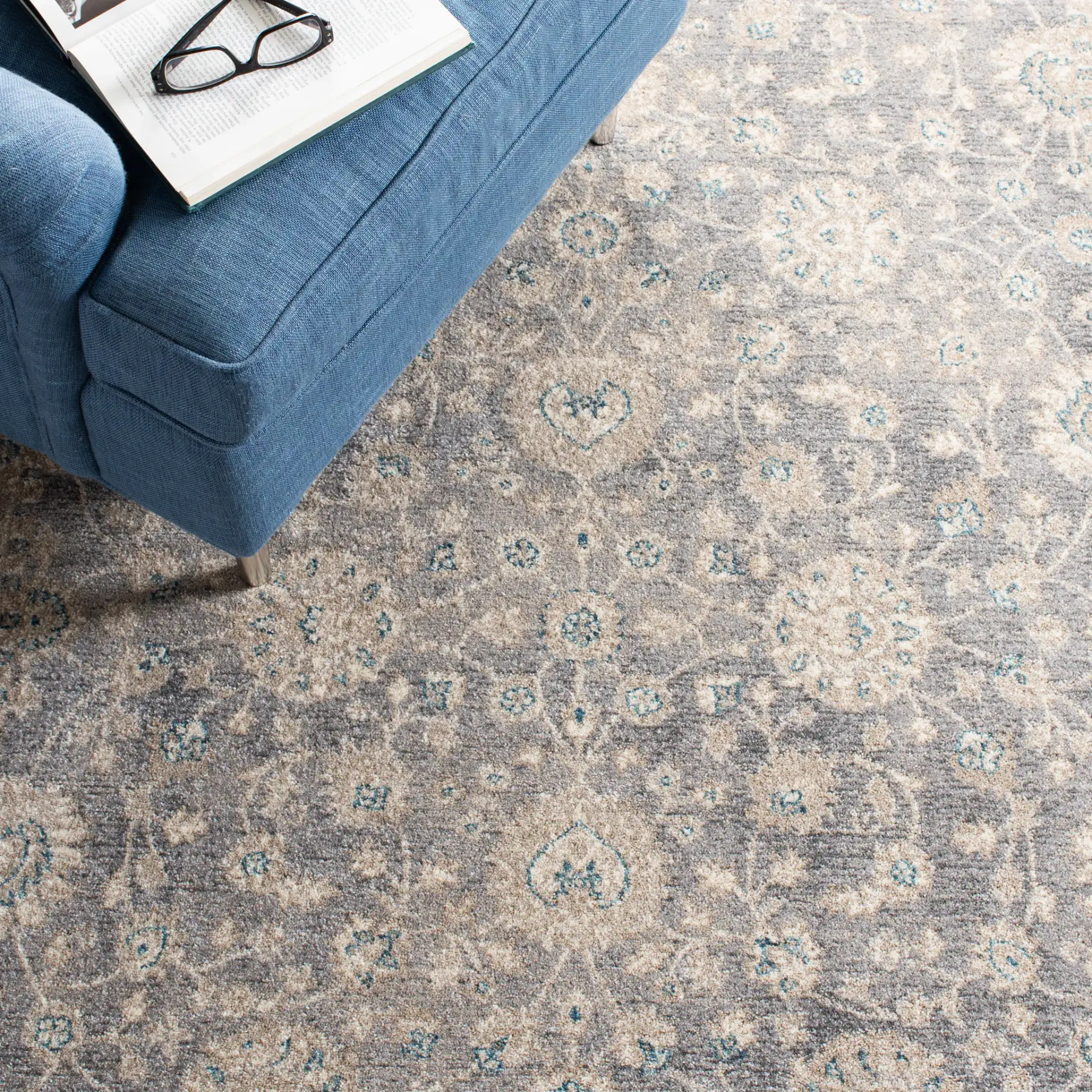 Sofia Allover Floral Bordered Rug in Light Gray / Beige in a styled room