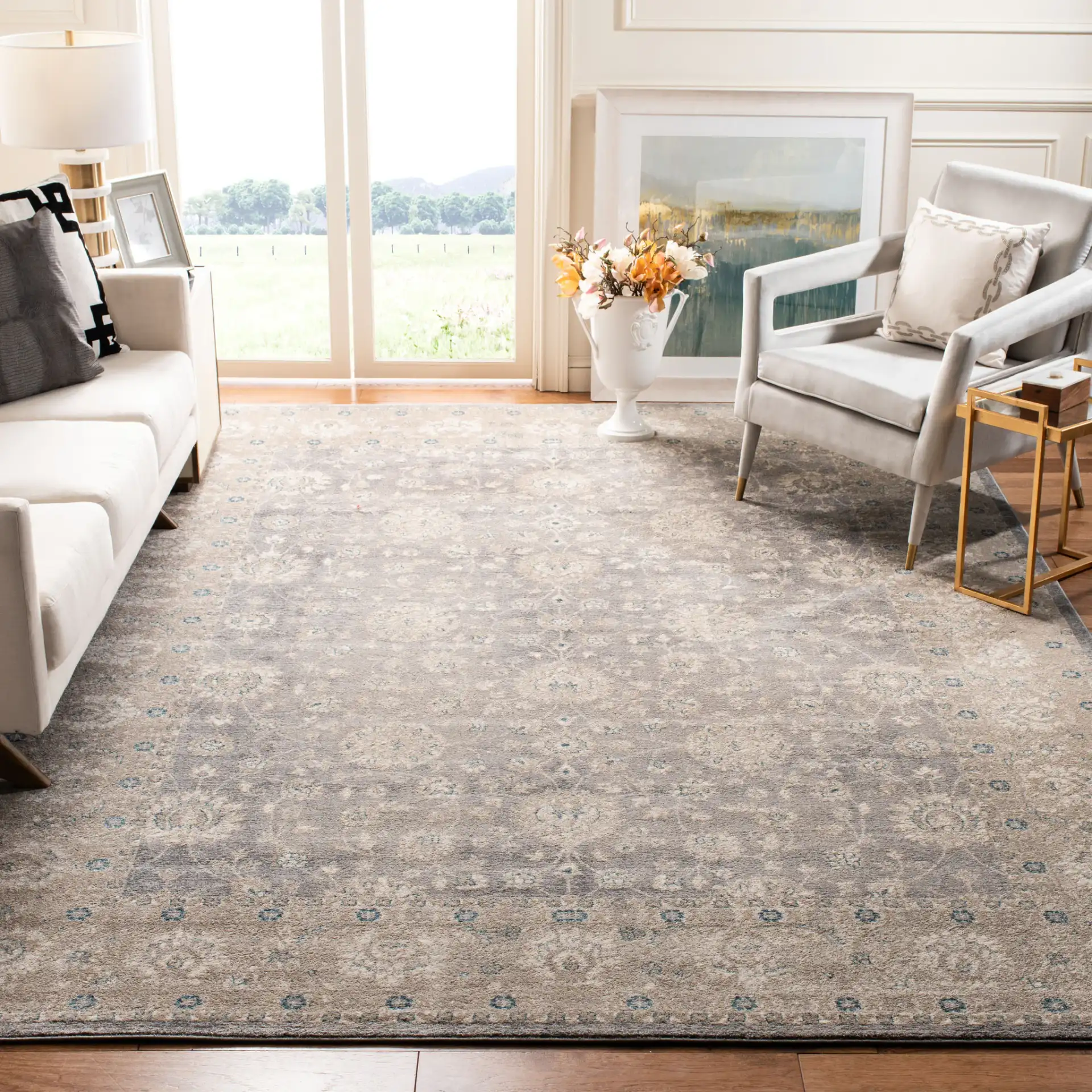 Sofia Allover Floral Bordered Rug in Light Gray / Beige in a styled room