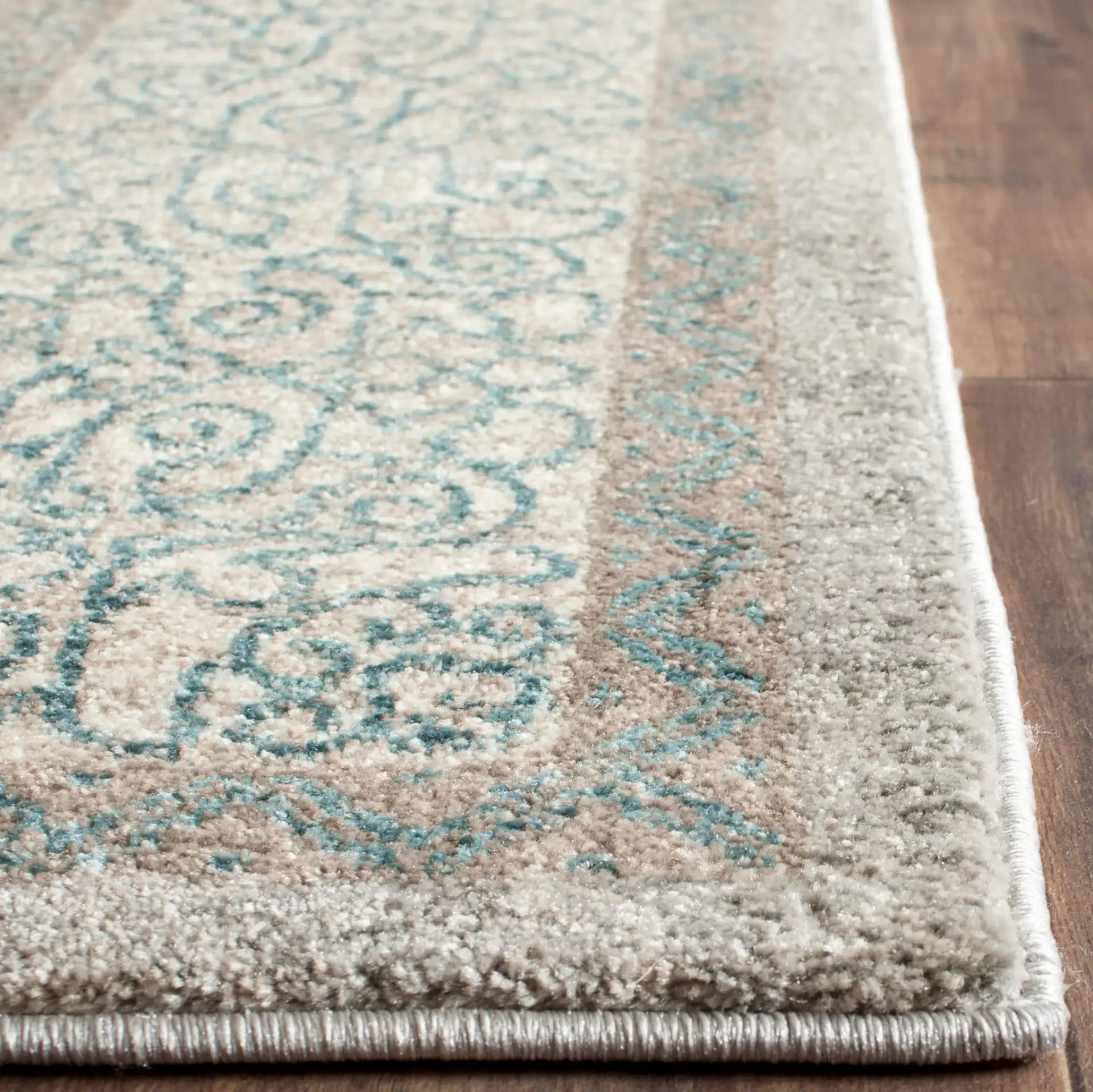Sofia Medallion Border Rug in Light Gray / Blue in a styled room