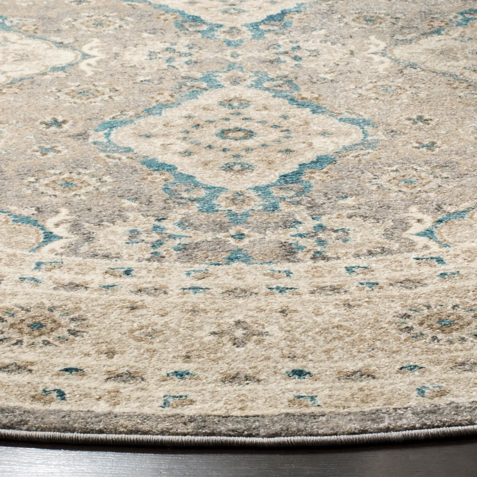 Sofia Medallion Bordered Rug in Light Gray / Beige in a styled room