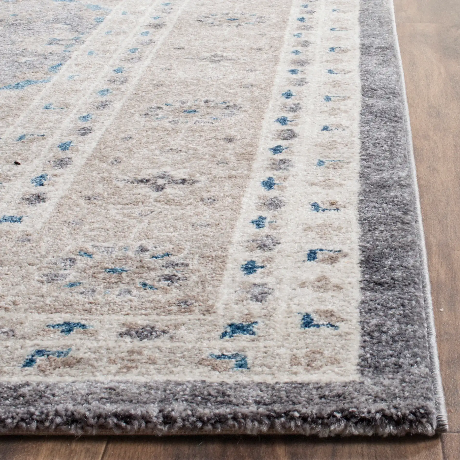 Sofia Medallion Bordered Rug in Light Gray / Beige in a styled room