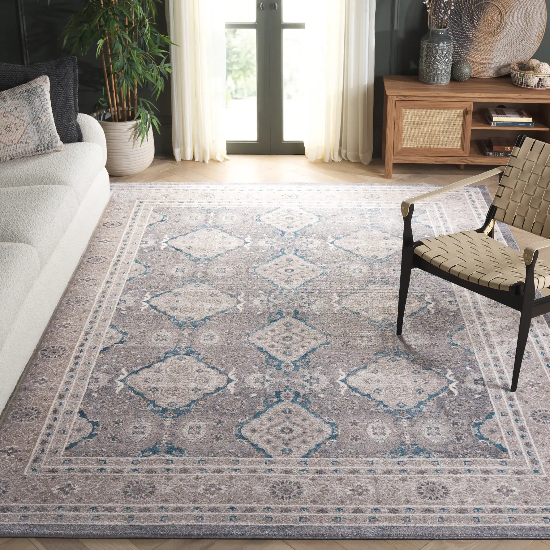 Sofia Medallion Bordered Rug in Light Gray / Beige in a styled room