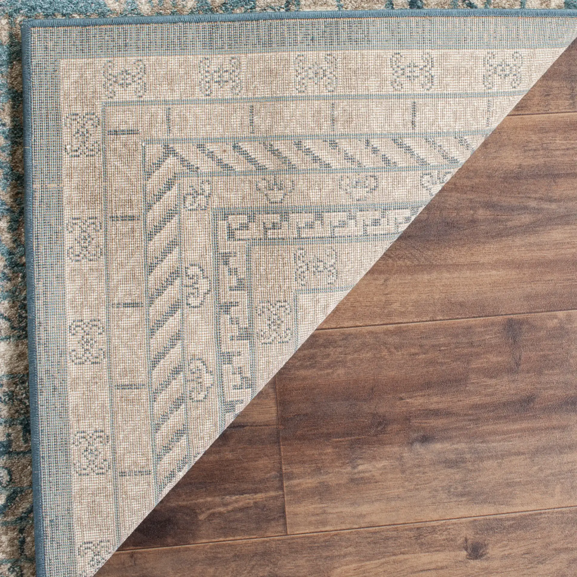 Sofia Bordered Floral Rug in Blue / Beige in a styled room