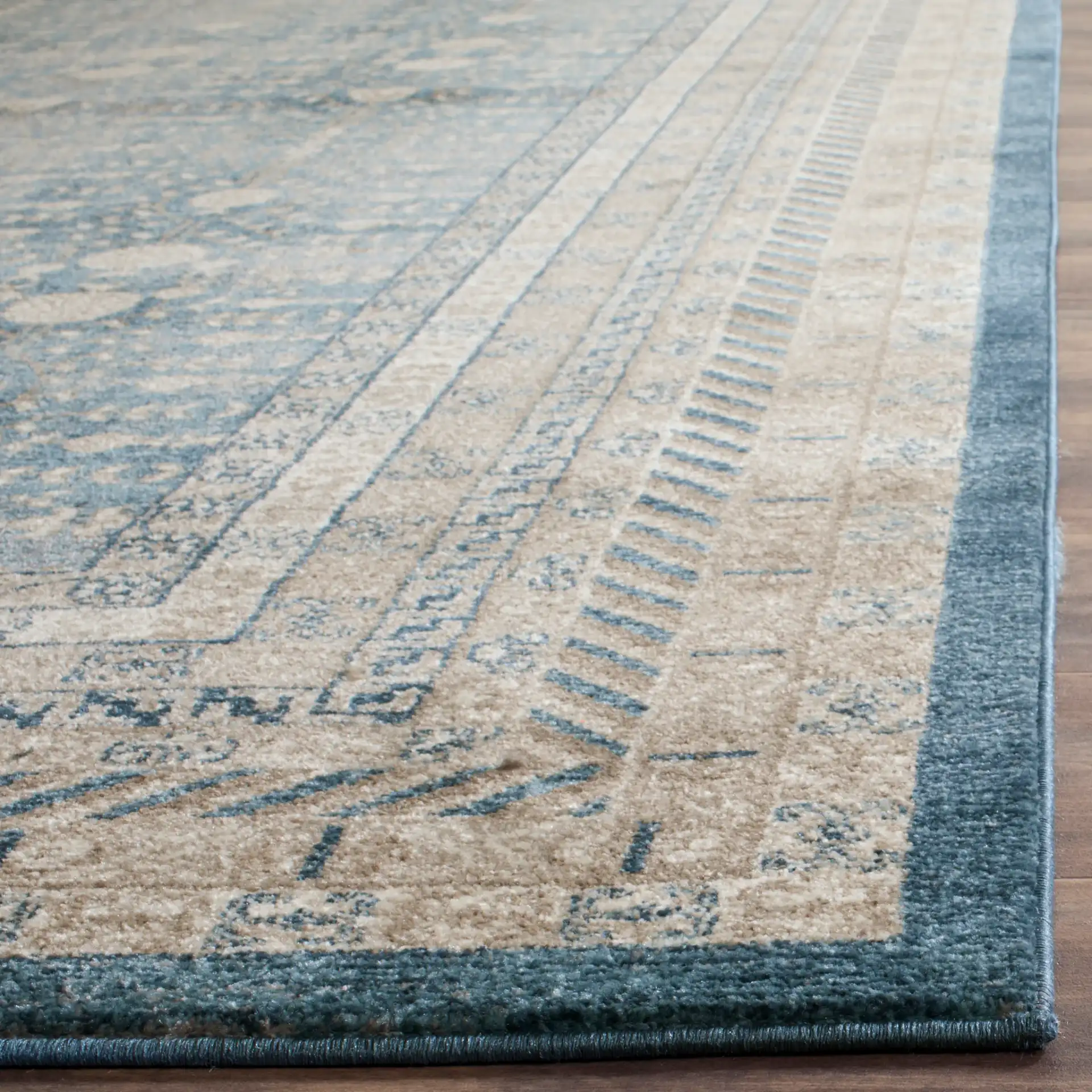 Sofia Bordered Floral Rug in Blue / Beige in a styled room
