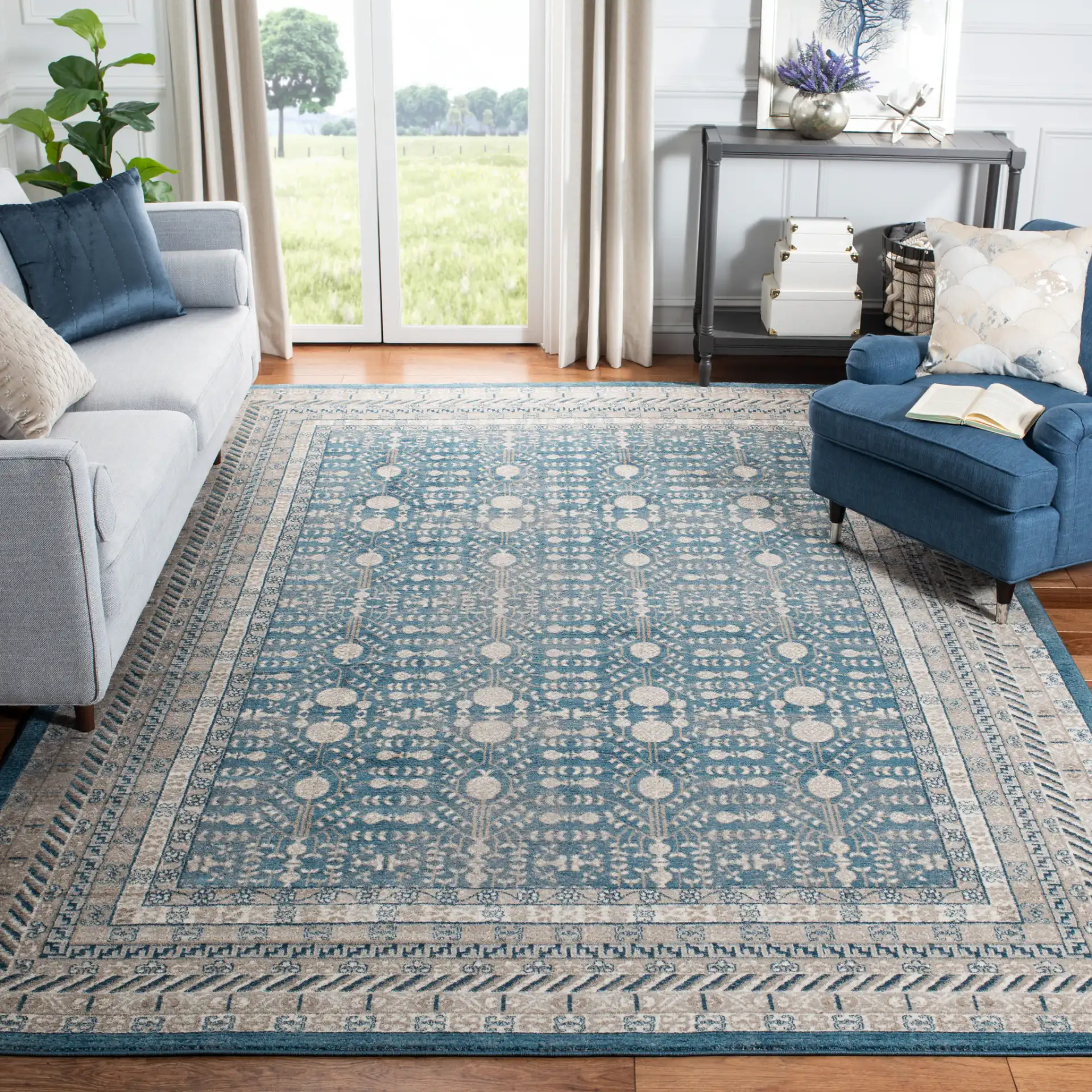 Sofia Bordered Floral Rug in Blue / Beige in a styled room